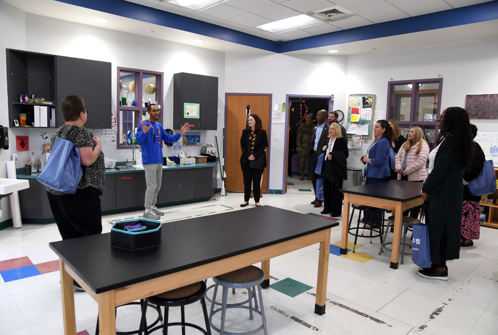 Marcus Jordan, 81st Force Support Squadron child and youth program assistant, provides a tour of the STEM lab inside the youth center to honorary commanders and civic leaders at Keesler Air Force Base, Mississippi, Feb. 17, 2023.