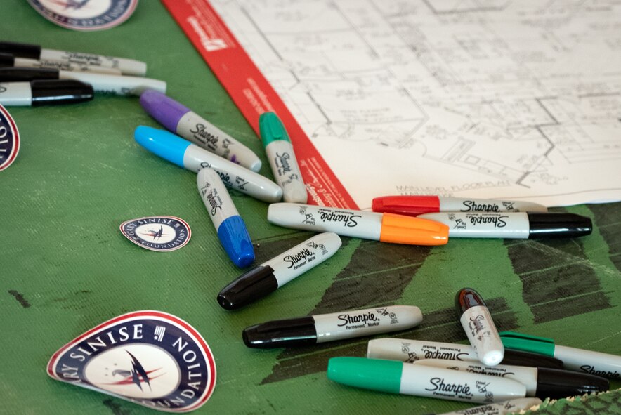 markers lay scattered on a table