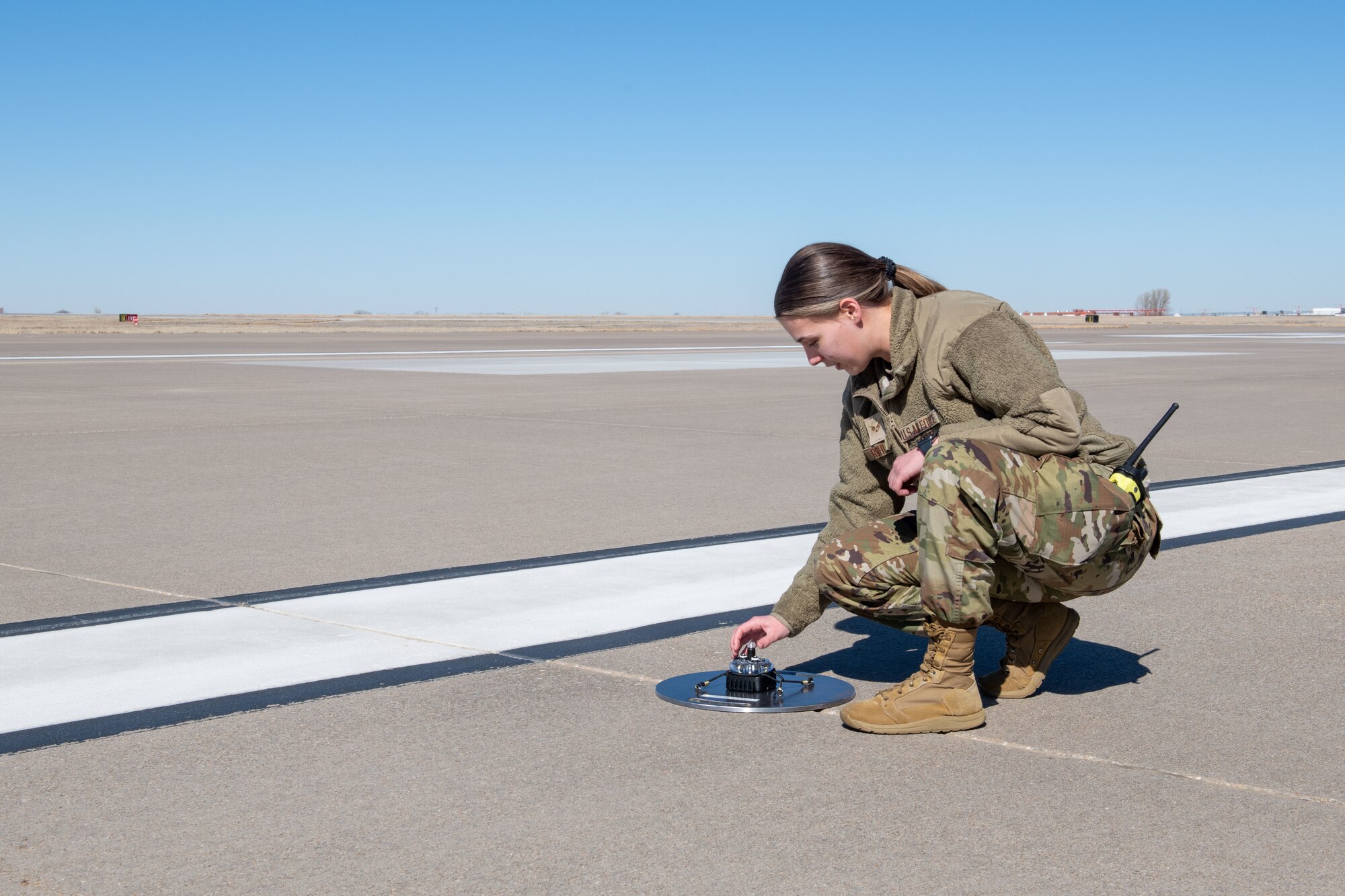 A close-up shot of a Phantom ALZ-15 portable landing zone light at McConnell Air Force Base, Kansas, Feb. 17, 2023. These lights are small, lightweight, and durable units that can be quickly deployed to mark a temporary landing zone for aircraft during emergency situations, disaster relief efforts, or military operations. These lights provide visual guidance for pilots during approach and landing, making it safer to land in remote or otherwise inaccessible locations. (U.S. Air Force photo by Staff Sgt. Adam Goodly)