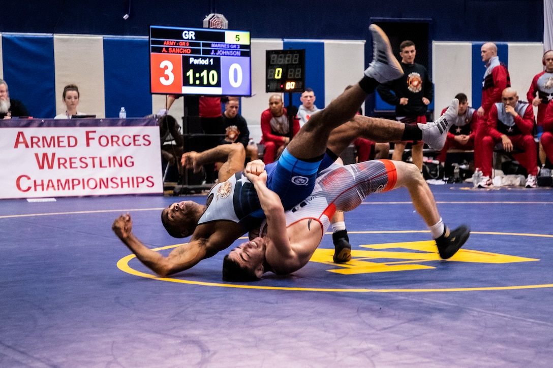 NAVAL BASE KITSAP, Wa. (Feb. 22, 2020) - Army Spc Alejandro Sancho (bottom) rolls his opponent during the Greco-Roman event during the final round of the 2020 Armed Forces Sports Wrestling Championship at the Bremeton Fitness Complex on Feb. 22. (U.S. Navy Photo by Mass Communication Specialist 1st Class Ian Carver/RELEASED).