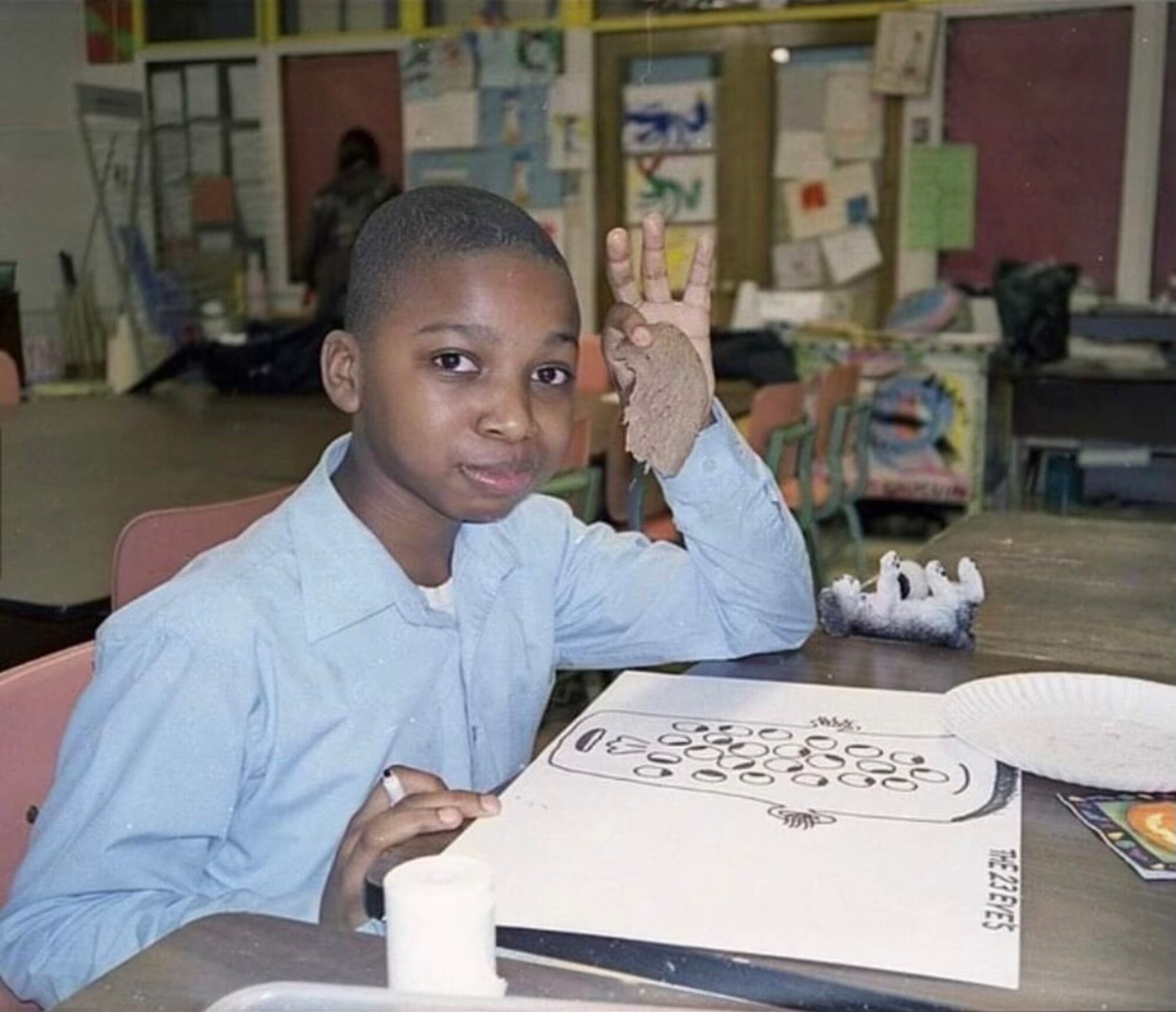 Michael Mason poses for a photo while working on an art project at St. Thomas The Apostle Catholic Grade School, Chicago, Illinois, 2008. Mason is currently serving as a patrolman at the 97th Security Forces Squadron at Altus Air Force Base, Oklahoma. (Courtesy photo by Airman 1st Class Michael Mason)
