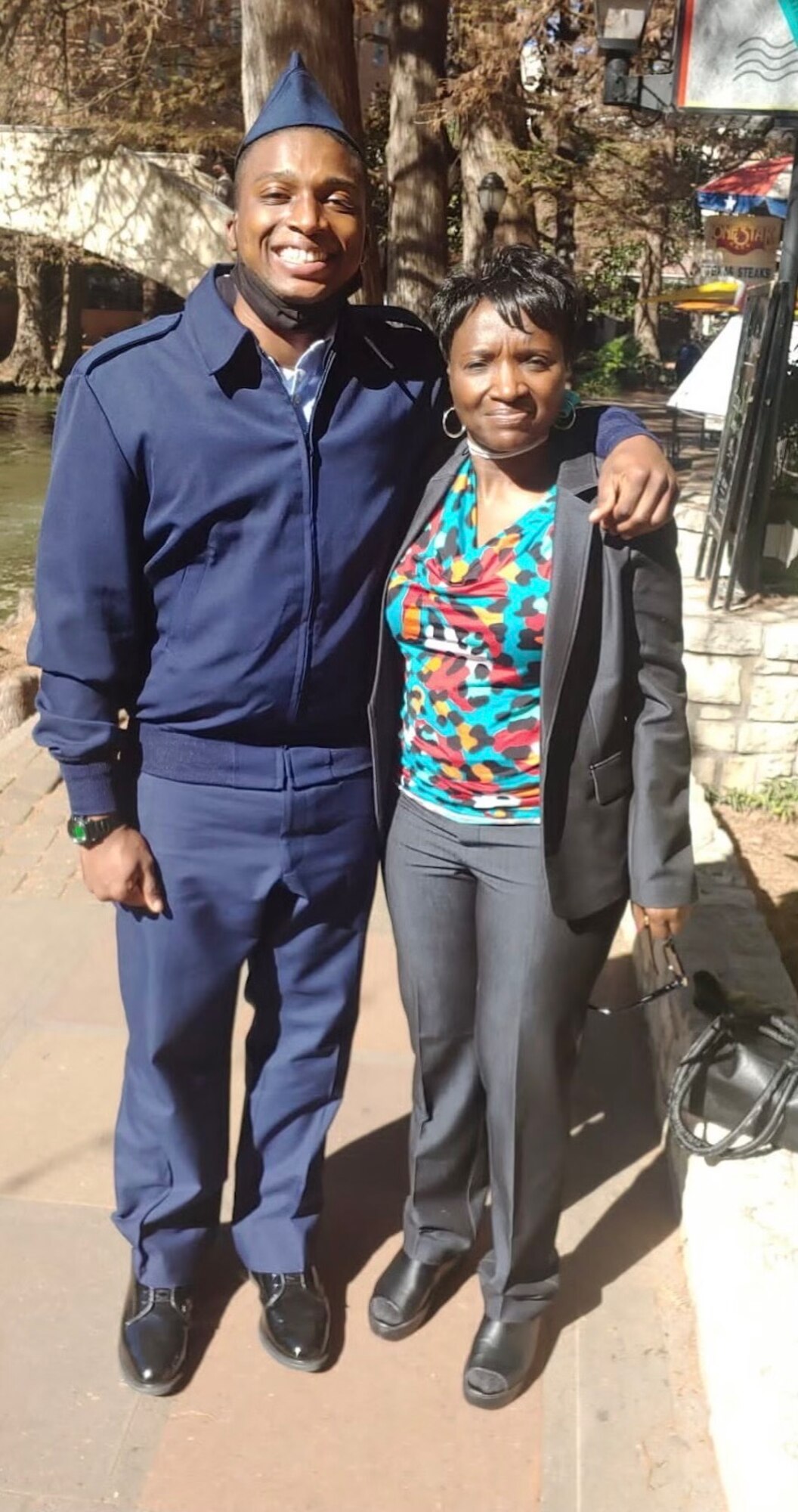 U.S. Air Force Airman Basic Michael Mason, 97th Security Forces Squadron Airman in training, poses for a photo with his mother at the Alamo in San Antonio, Texas, Jan. 7, 2022. All security forces defenders are trained at the Air Force Security Forces Academy at Lackland Air Force Base, Texas. (Courtesy photo by Airman 1st Class Michael Mason)