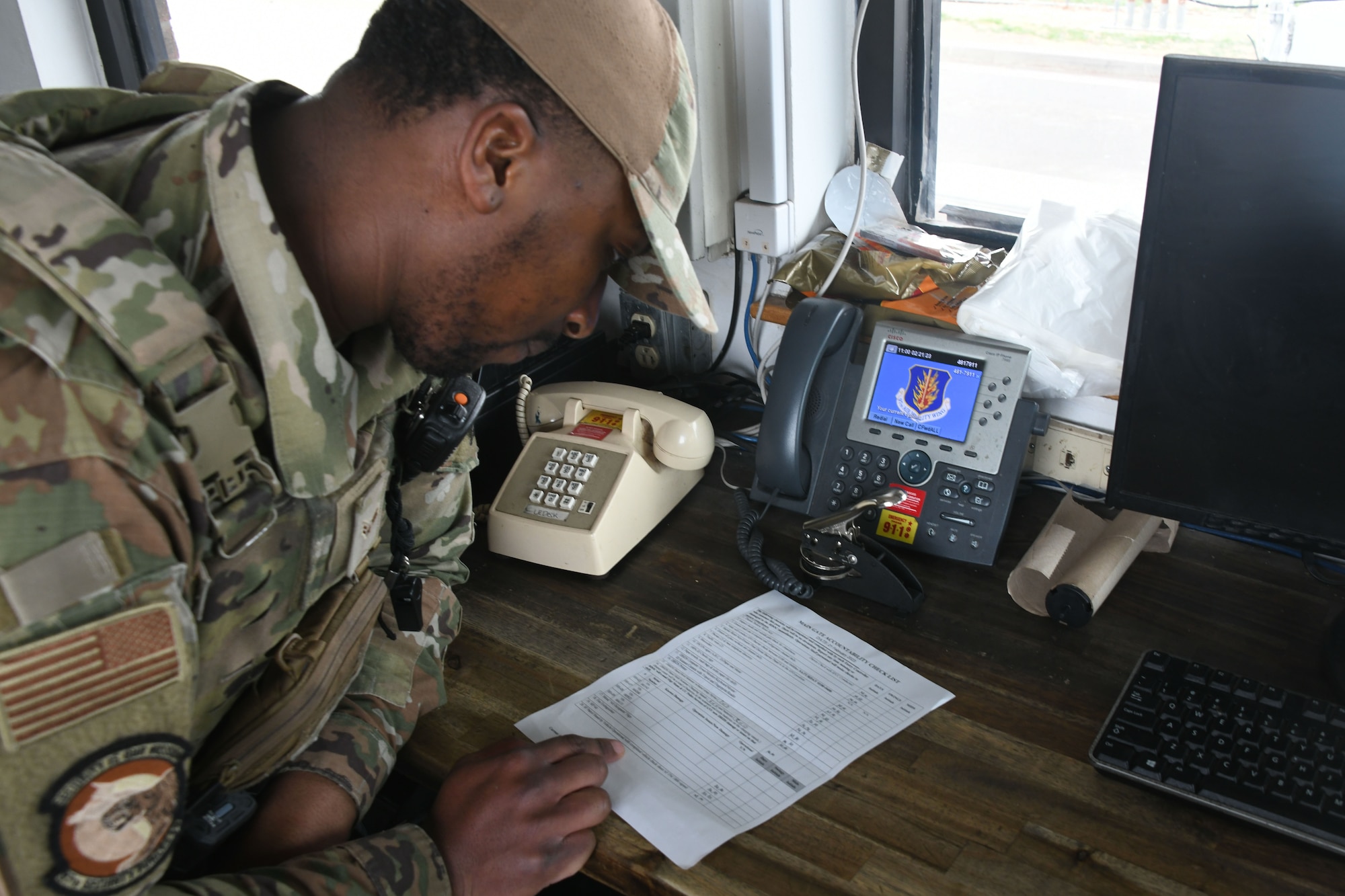 U.S. Air Force Airman 1st Class Michael Mason, 97th Security Forces Squadron patrolman, goes over an accountability checklist at Altus Air Force Base, Oklahoma, Feb. 21, 2023. Patrolmen defend the base’s personnel, equipment and resources on a day to day basis. (U.S. Air Force photo by Airman 1st Class Miyah Gray)