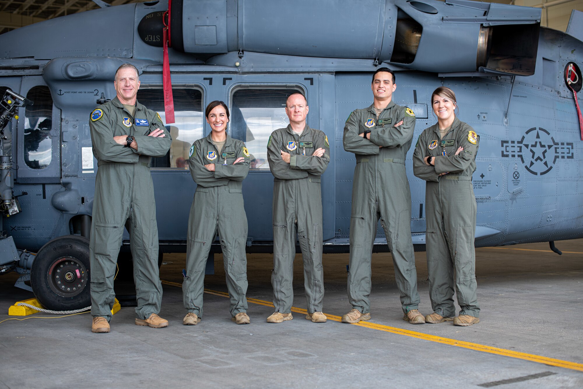 Airmen pose for a photo.