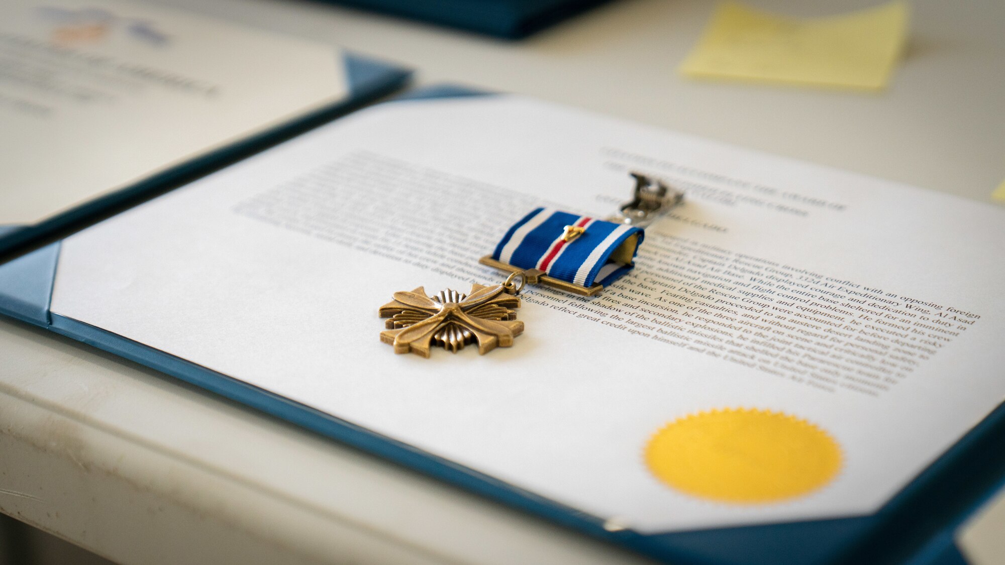 A medal is laid out.