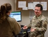 U.S. Air Force Staff Sgt. David Zahm (right) and Master Sgt. Shaundra Andress (left) communicate about an upcoming project for the base comm office. (Air National Guard photo by: Tech Sgt. Nicholas Perez)