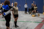 A female Airman is measured during a Sword Athena event at Langley, Virginia during May 2022. (USAF photo / Jim Varhegyi)