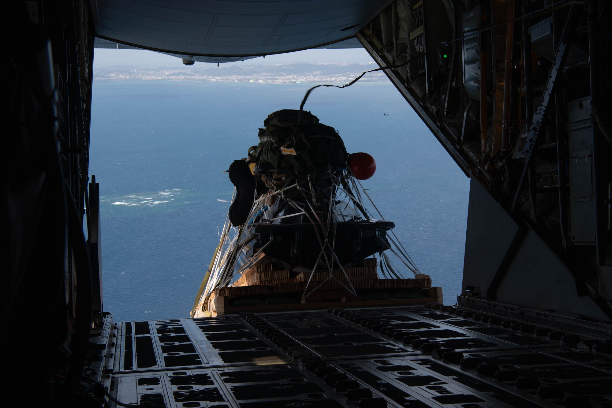 Equipment is air dropped from an aircraft.