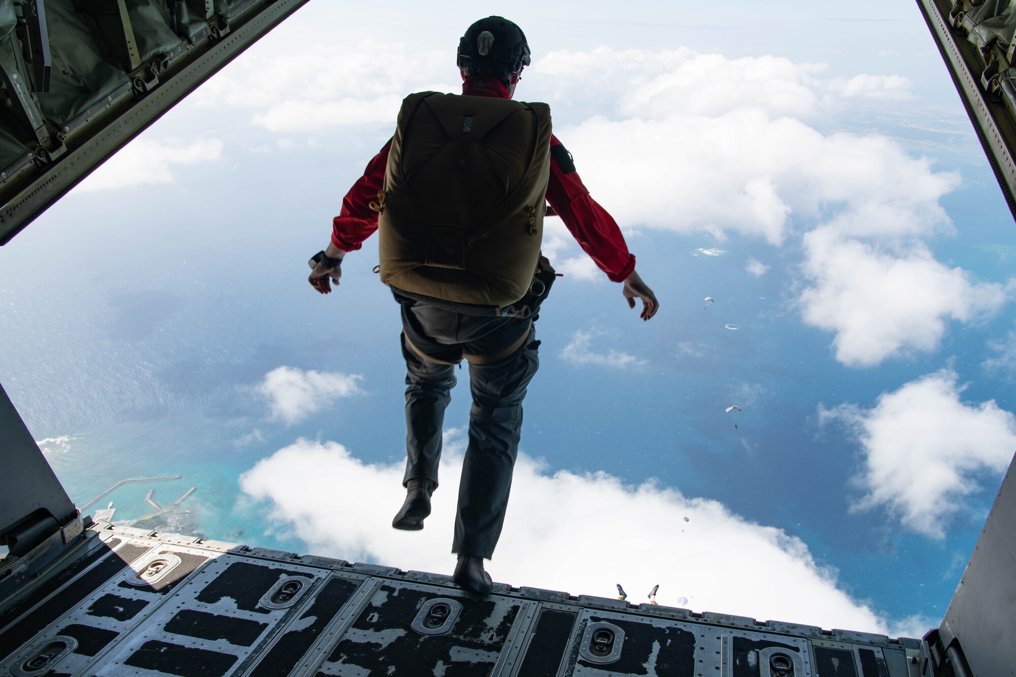 An Airman jumps out of an aircraft.