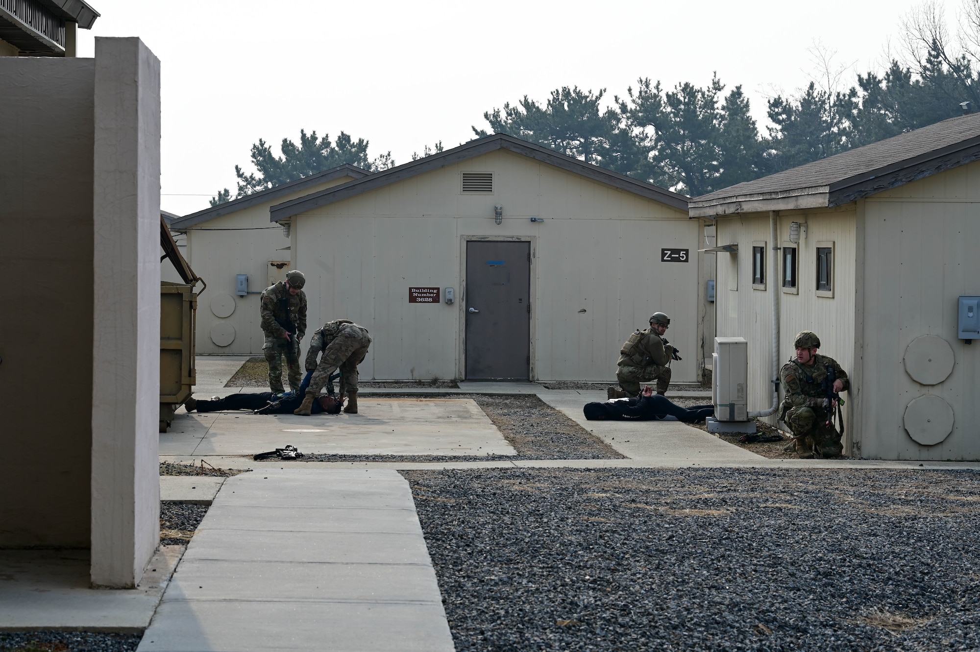 Defenders from the 8th Security Forces Squadron, provide a demonstration to visiting leaders during the Wolf Leadership Forum, at Kunsan Air Base, Republic of Korea, Feb. 23, 2023. The tactics showed visiting leaders their execution processes for engaging with possible threats. (U.S. Air Force photo by Senior Airman Shannon Braaten)