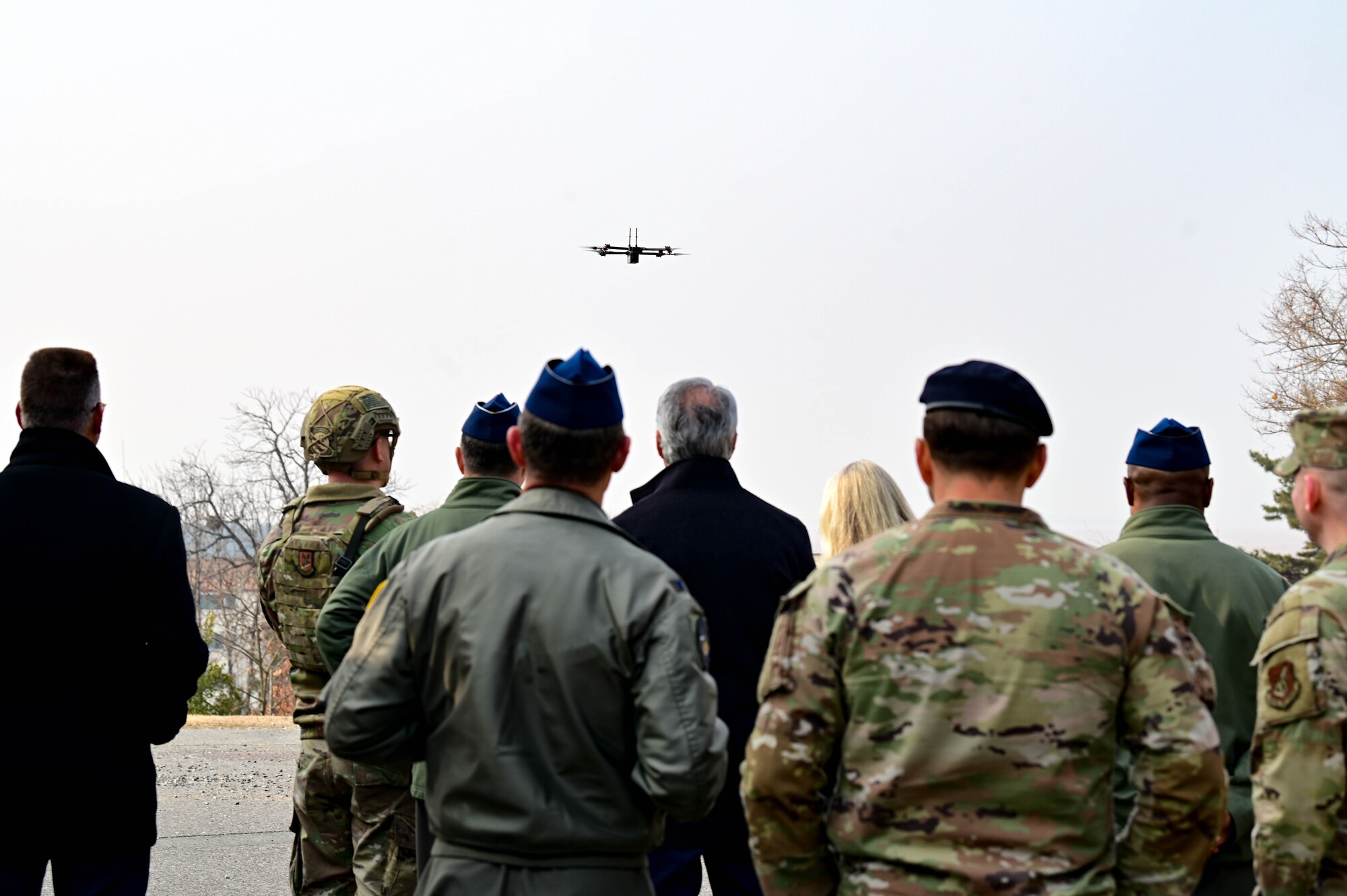 Former and current Wolf Pack leaders view a small, unmanned aircraft system (sUAS) demonstration during the Wolf Leadership Forum, at Kunsan Air Base, Republic of Korea, Feb. 23, 2023. The purpose of this demonstration was to display combat readiness capability against enemy sUAS invasions. (U.S. Air Force photo by Senior Airman Shannon Braaten)
