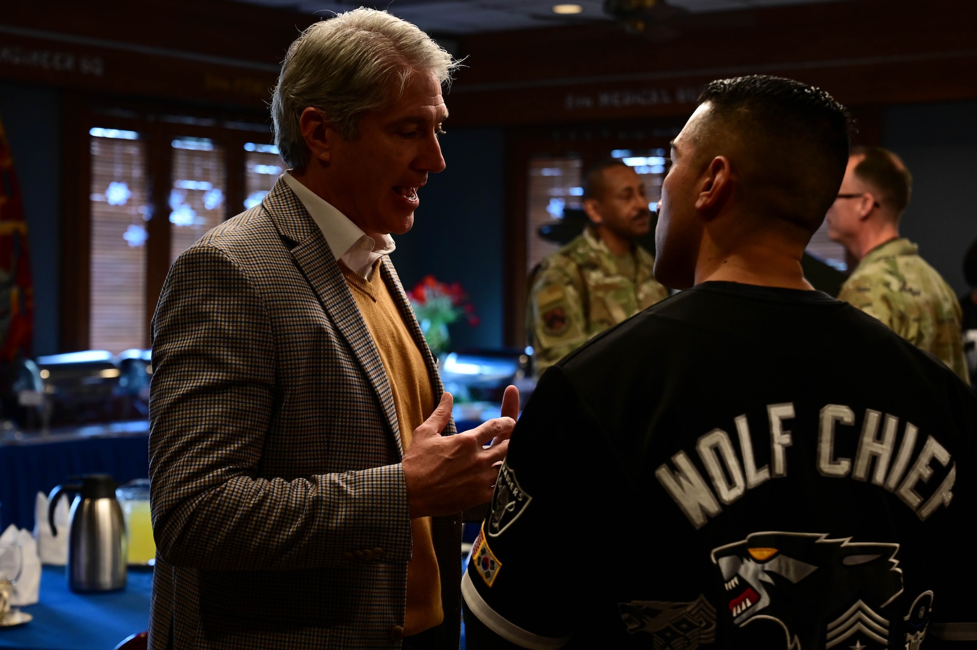 Retired Brig. Gen. Jeremy Sloane, ‘Wolf’ class of 2015-2016, speaks with Chief Master Sgt. Carlos “Wolf Chief” Damian, 8th Fighter Wing command chief, during the Wolf Pack Leadership Forum during the Wolf Leadership Forum, at Kunsan Air Base, Republic of Korea, Feb. 23, 2023. As part of the Wolf Leadership Forum, former leaders of Kunsan Air Base returned to visit and learn about how the Wolfpack currently operates. (U.S. Air Force photo by Senior Airman Shannon Braaten)