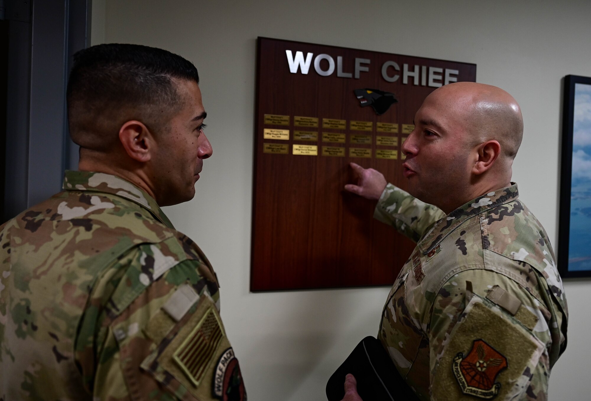 Chief Master Sgt. Carlos “Wolf Chief” Damian (left), 8th Fighter Wing command chief, listens as Chief Master Sgt. Steve Cenov, 8th Air Force command chief, at Kunsan Air Base, Republic of Korea, Feb. 23, 2023. Cenov was the Command Chief Master Sergeant for the 8th Fighter Wing from May 2019 to May 2020. (U.S. Air Force photo by Senior Airman Shannon Braaten)