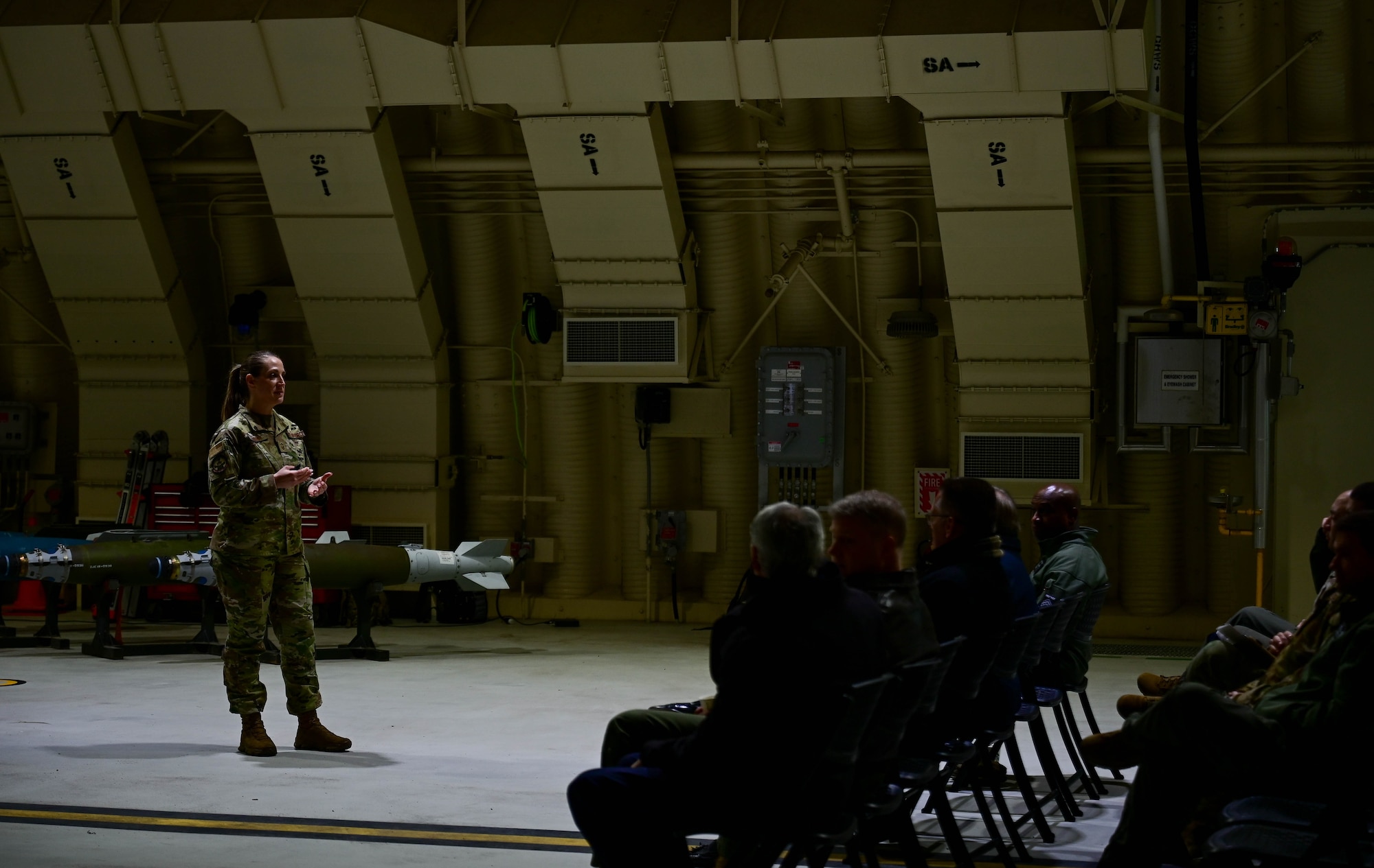 Senior Master Sgt. Krystal Rankin, 8th Operations Support Squadron airfield manager, gives a briefing to visiting leaders during the Wolf Pack Leadership Forum at Kunsan Air Base at Kunsan Air Base, Republic of Korea, Feb. 23, 2023. Designed to enrich Airmen, the forum immersed visiting leaders in the Wolf Pack mission while allowing them to share experiences and knowledge. (U.S. Air Force photo by Senior Airman Shannon Braaten)