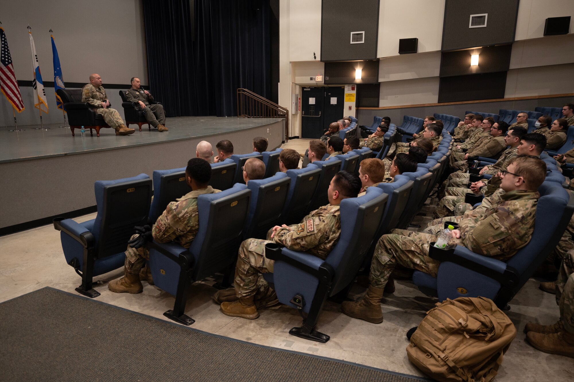 Retired Maj. Gen. Brian Bishop (center left), and Brig. Gen. David G. Shoemaker (center right), U.S. Indo-Pacific Command director of operations, addressed the Airmen at Kunsan Air Base, Republic of Korea, Feb. 24, 2023. Bishop was the 8th Fighter Wing commander in 2005 to 2006 and Shoemaker was the 8th FW commander in 2017 to 2018. (U.S. Air Force photo by Senior Airman Akeem K. Campbell)