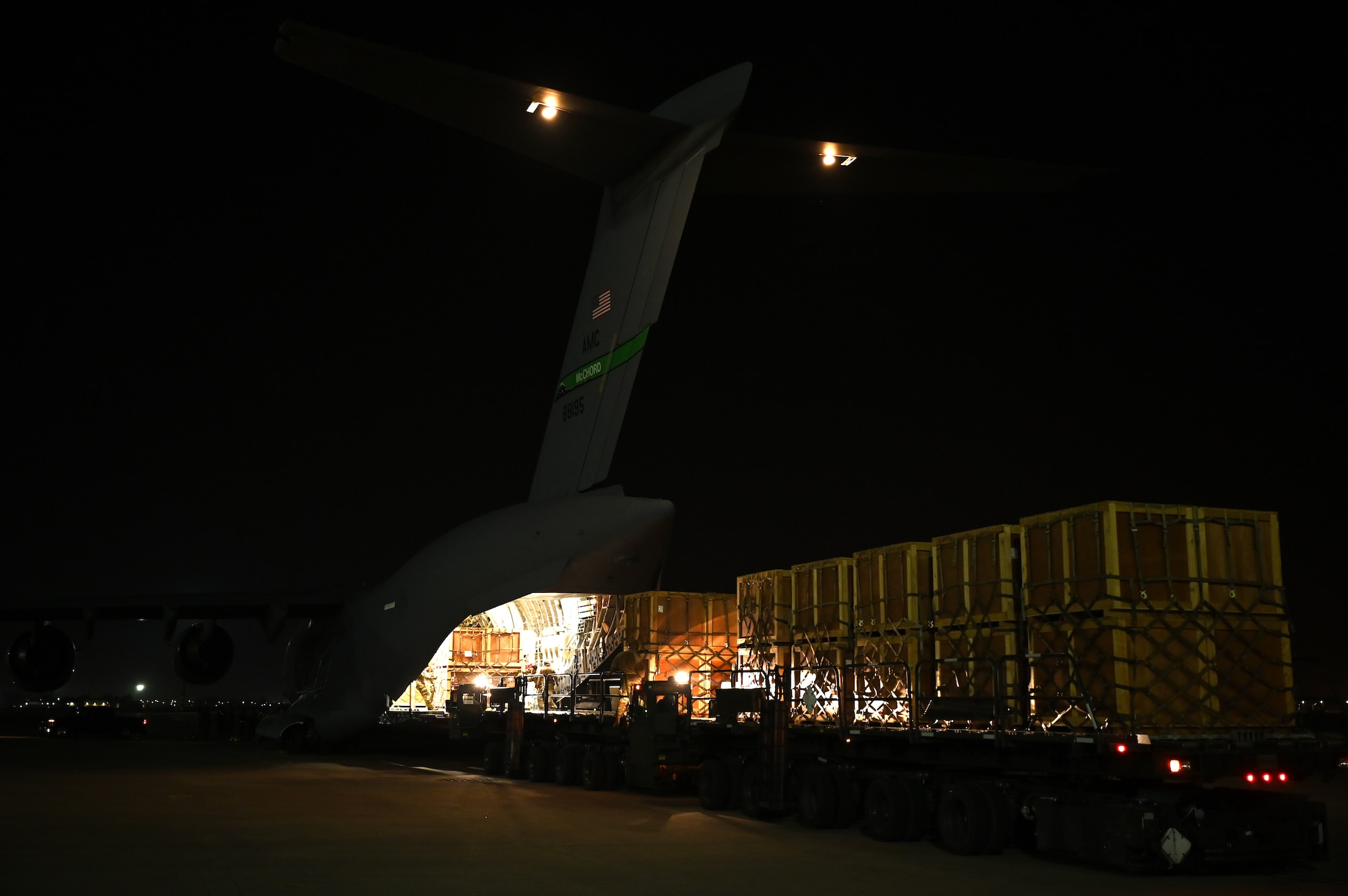 U.S. Air Force Airmen unload humanitarian aid supplies from a C-17 Globemaster III assigned to the 8th Expeditionary Airlift Squadron, to provide international aid to Türkiye at Incirlik Air Base, Türkiye, Feb. 21, 2023. The 8th EAS personnel airlifted more than 300,000 pounds of aid, providing humanitarian assistance in response to the devastating impacts in Türkiye following the worst earthquake to hit the region in almost a century. (U.S. Air Force photo by Staff Sgt. Gerald R. Willis)