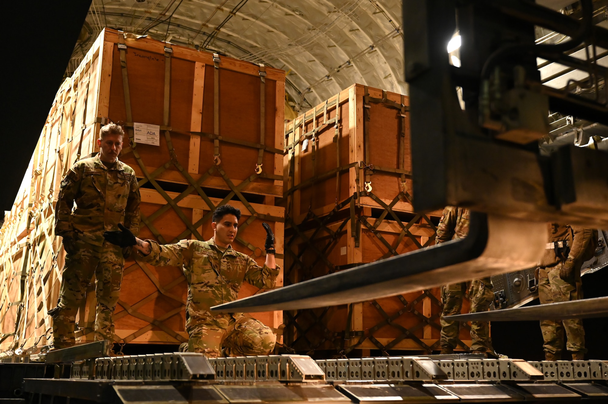 U.S. Air Force Airmen unload humanitarian aid supplies from a C-17 Globemaster III assigned to the 8th Expeditionary Airlift Squadron, to provide international aid to Türkiye at Incirlik Air Base, Türkiye, Feb. 21, 2023. The 8th EAS personnel airlifted more than 300,000 pounds of aid, providing humanitarian assistance in response to the devastating impacts in Türkiye following the worst earthquake to hit the region in almost a century. (U.S. Air Force photo by Staff Sgt. Gerald R. Willis)