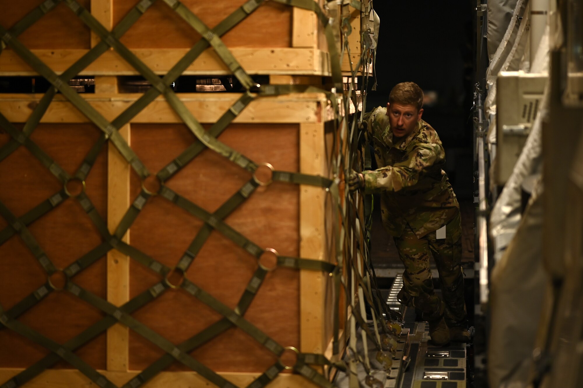 Staff Sgt. Nicholas Hartley, 8th Expeditionary Airlift Squadron loadmaster, loads humanitarian aid supplies onto a C-17 Globemaster III to provide international aid to Türkiye in the U.S. Central Command area of responsibility, Feb. 21, 2023.
The 8th EAS personnel airlifted more than 300,000 pounds of aid, providing humanitarian assistance in response to the devastating impacts in Türkiye following the worst earthquake to hit the region in almost a century. (U.S. Air Force photo by Staff Sgt. Gerald R. Willis)