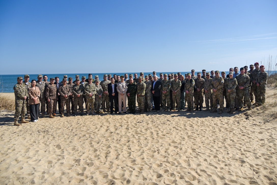 Personnel from U.S., Tajikistan, Uzbekistan, Kazakhstan, Mongolia, Kyrgyzstan and Pakistan pose together for a group photo at the Initial Planning Conference, or IPC, for Regional Cooperation 23 Feb. 21, 2023, in Virginia Beach, Virginia. RC 23 is an annual, multi-national U.S. Central Command-sponsored exercise conducted by U.S. forces in partnership with Central and South Asia nations. During the IPC, the attendees worked to develop the exercise scenario and identify key training objectives in advance of the exercise, which will take place later this year. (U.S. Army National Guard photo by Sgt. 1st Class Terra C. Gatti)