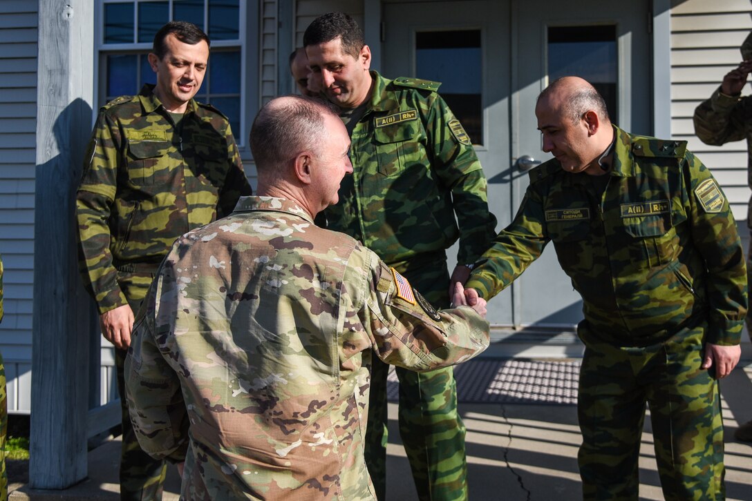 Brig. Gen. James W. Ring, the director of the joint staff for the Virgina National Guard, meets with members of the Tajikistan delegation at the Initial Planning Conference, or IPC, for Regional Cooperation 23 Feb. 21, 2023, in Virginia Beach, Virginia. Tajikistan and Virginia have worked together though the National Guard's State Partnership Program and will celebrate 20 years of partnership this year. RC 23 is an annual, multi-national U.S. Central Command-sponsored exercise conducted by U.S. forces in partnership with Central and South Asia nations. (U.S. Army National Guard photo by Sgt. 1st Class Terra C. Gatti)