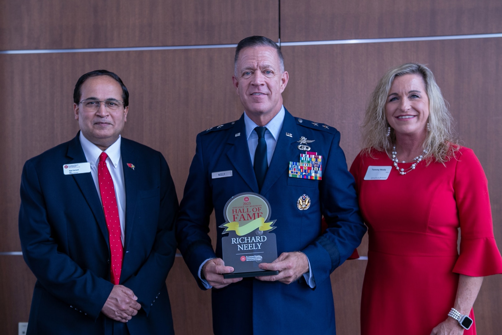 Ajay Samant, Dean of the Illinois State University College of Business, presents Maj. Gen. Rich Neely, the Adjutant General of Illinois and Commander of the Illinois National Guard, with the Hall of Fame award during the induction ceremony Feb. 23 at the ISU campus in Normal, Illinois.
