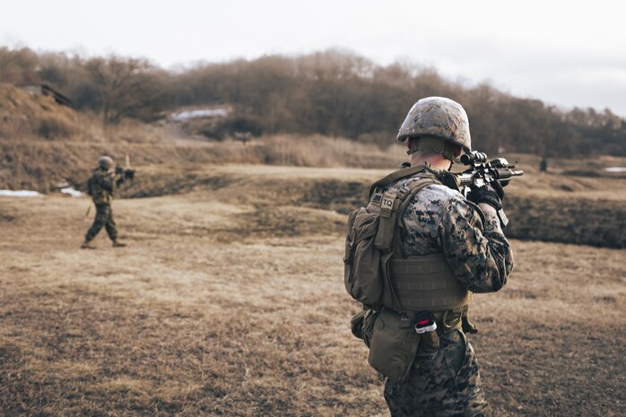 U.S. Marine Corps Sgt. Ethan Jara, a native of East Bethel, Minnesota and an ammunition technician with III Marine Expeditionary Force Support Battalion, III Marine Expeditionary Force Information Group, observes his fire team maneuver on an Infantry Platoon Battle Course during a live fire range on U.S. Army Garrison Casey, Gyeonggi, South Korea, Feb. 10, 2023. III MSB is conducting Bushido Strike 23, which comprises training events including a Marine Corps Combat Readiness Evaluation in South Korea to validate its mission essential tasks of providing combat service, security, and administrative services to III Marine Expeditionary Force.