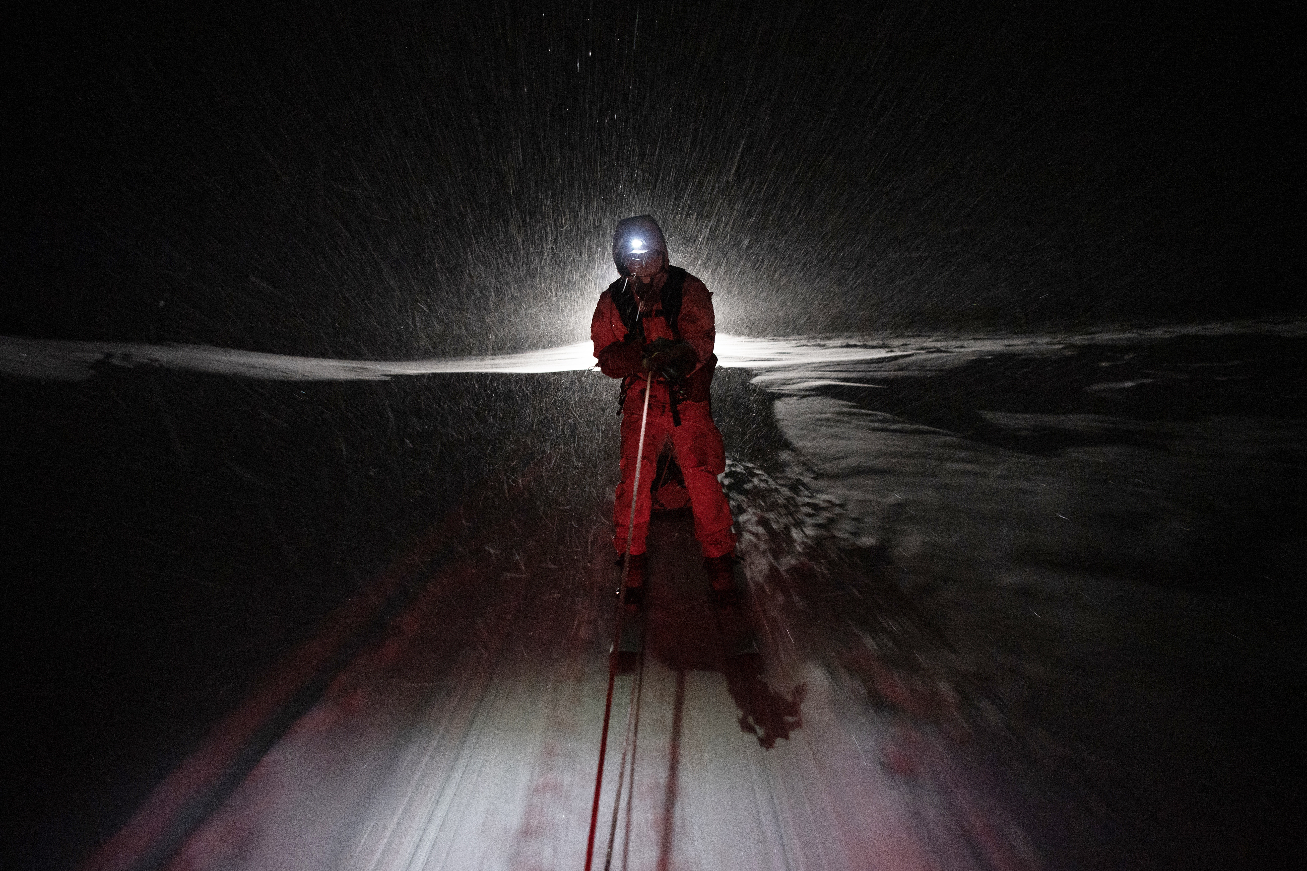 Air Force Capt. Travis Hunt is pulled by a snow machine while skijoring along the Denali Highway, Alaska