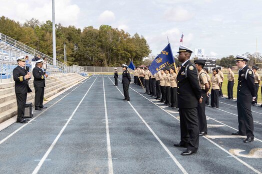  Capt. Stephen Audelo, left, Naval Education and Training Command’s (NETC) executive assistant, speaks to Navy Junior Reserve Officers Training Corps students following an inspection at Booker T. Washington High School in Pensacola, Florida, Feb. 15, 2023. NETC's mission is to recruit, train and deliver those who serve our nation, taking them from street-to-fleet by transforming civilians into highly skilled, operational and combat ready warfighters. (United States Navy photo by Mass Communication Specialist 2nd Class Zachary Melvin)