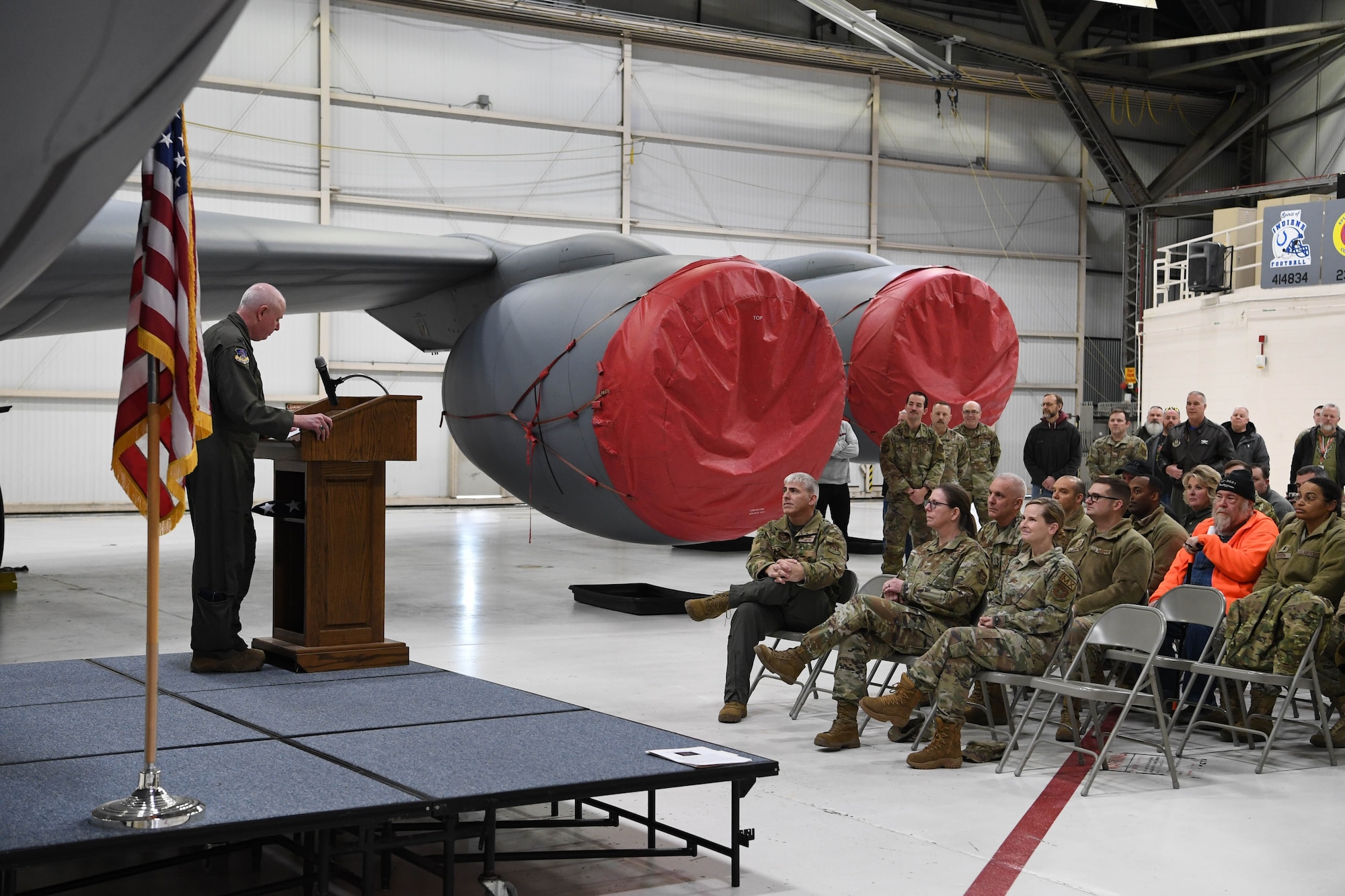 Col Thom Pemberton, 434th Air Refueling Wing commander, talks to current and former 434th Air Refueling Wing members during retirement ceremony for  KC-135R 62-3530 on February 24, 2023.  The aircraft will head to the boneyard after more than 60 years of service. (Photo by Douglas Hays)