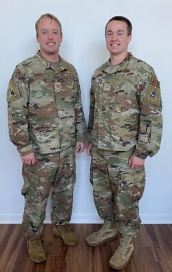 U.S. Air Force Tech. Sgt. David Clark, Space Launch Delta 45 Legal non-commissioned officer in charge of inspections and training readiness, and U.S. Air Force Staff Sgt. Michael Clark, 45th Launch Readiness Squadron air traffic controller pose for a photo at Patrick Space Force Base, Fla. Dec. 15, 2022. David Clark and Michael Clark are brothers who have been stationed at Patrick SFB together. (Courtesy Photo)