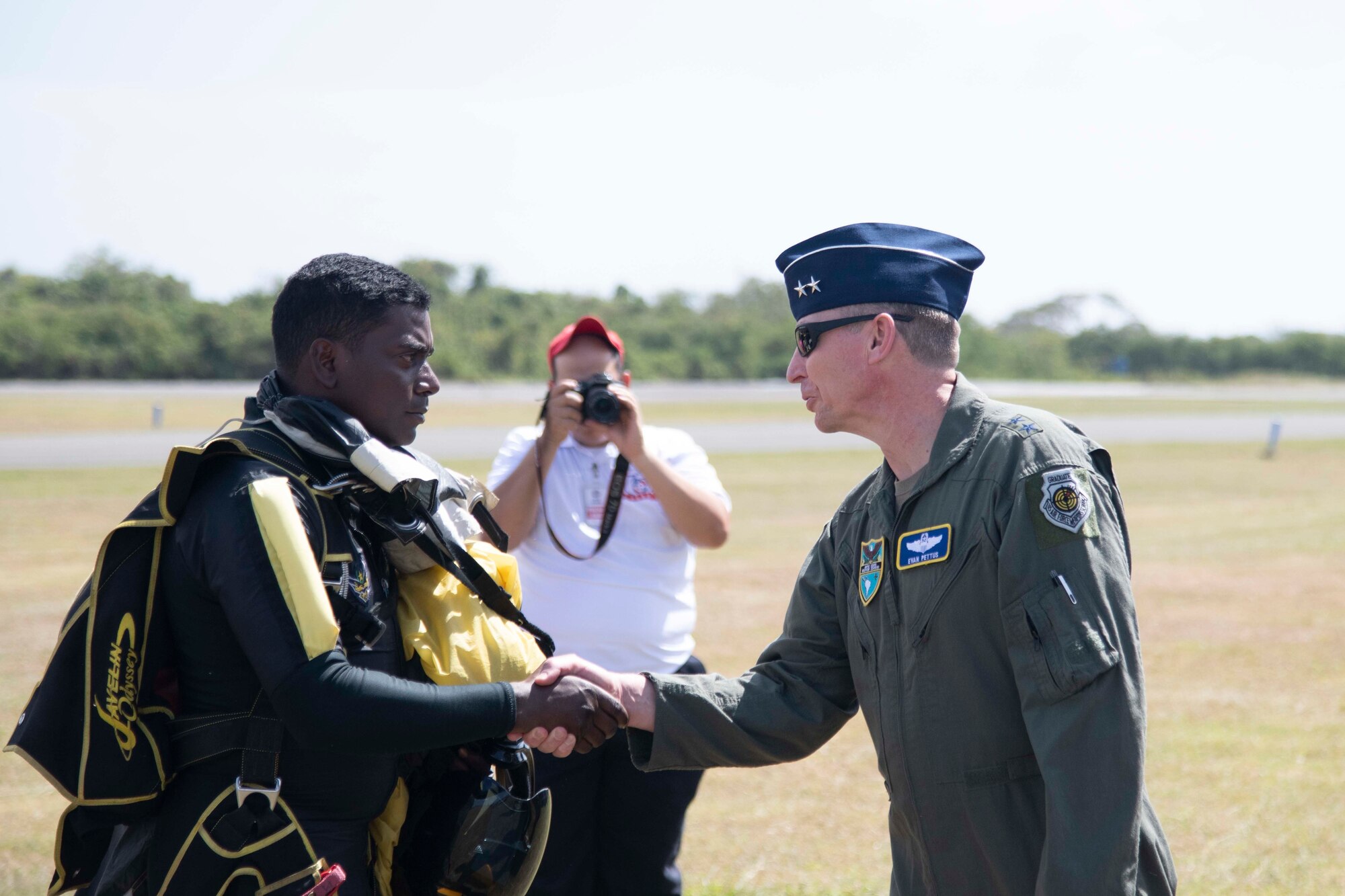 Commander shakes hands