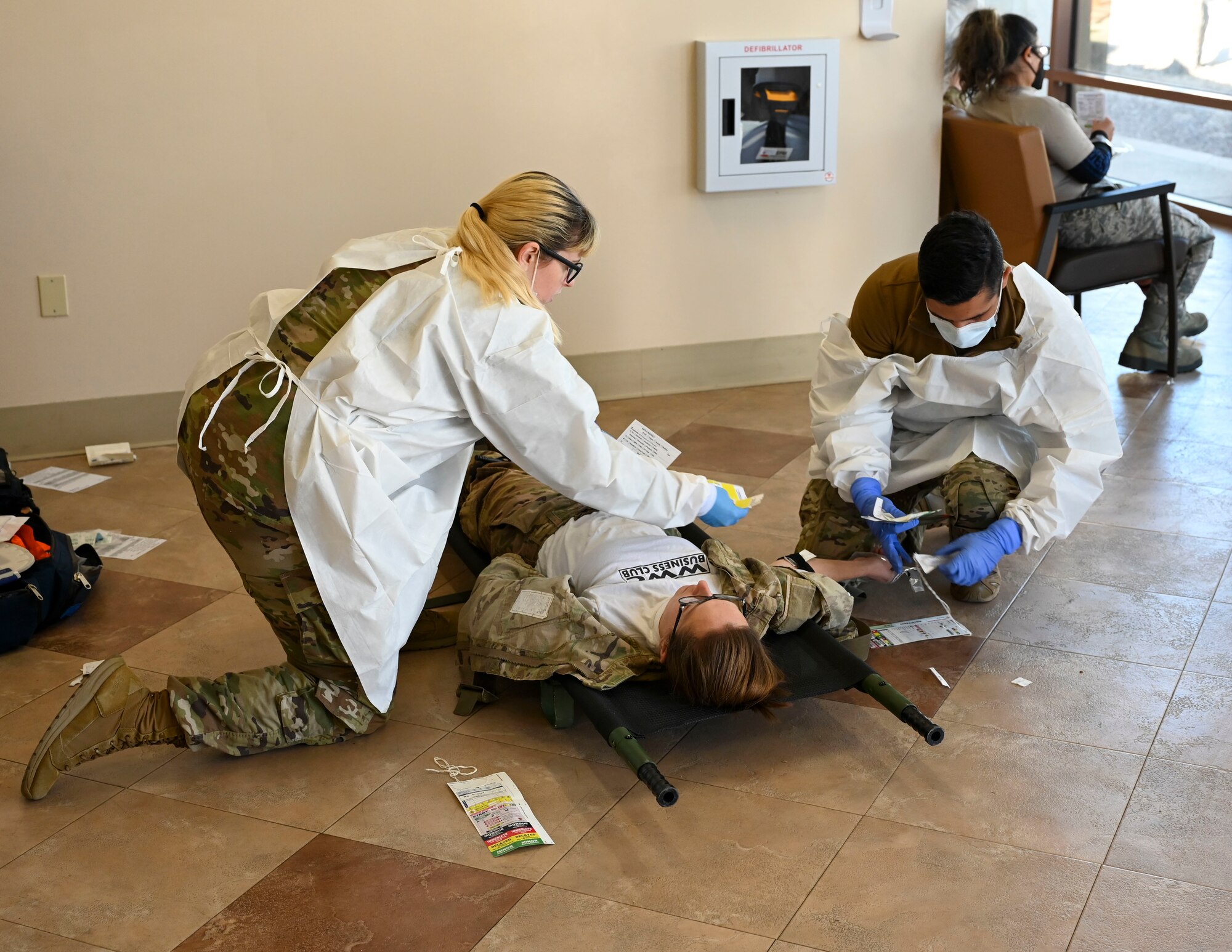 Airmen provide treatment to simulated casualties during a mass casualty training exercise at Davis-Monthan Air Force Base