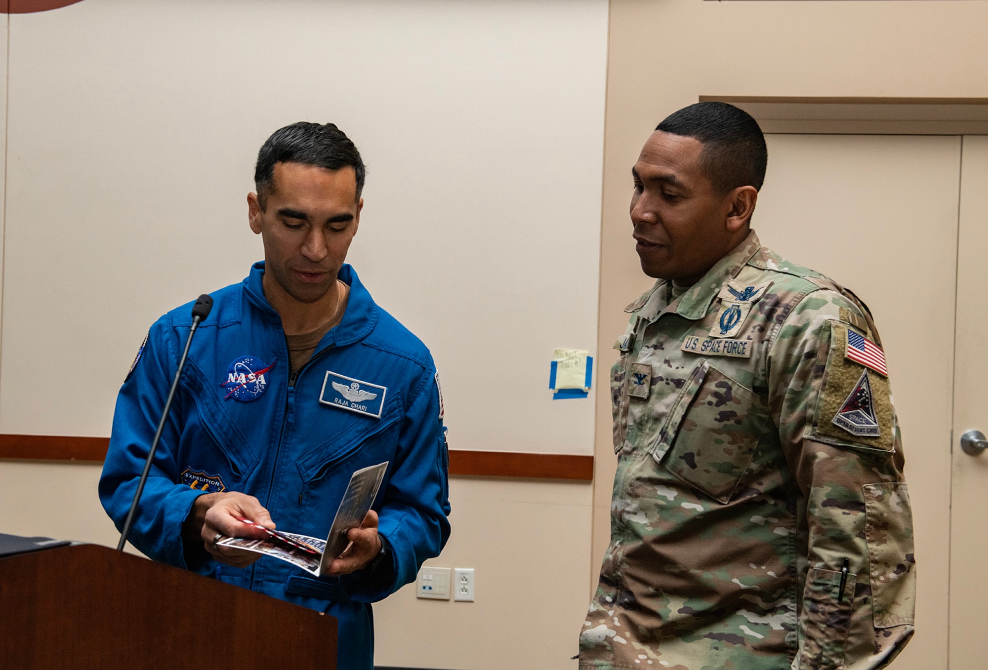 Astronaut gives award.