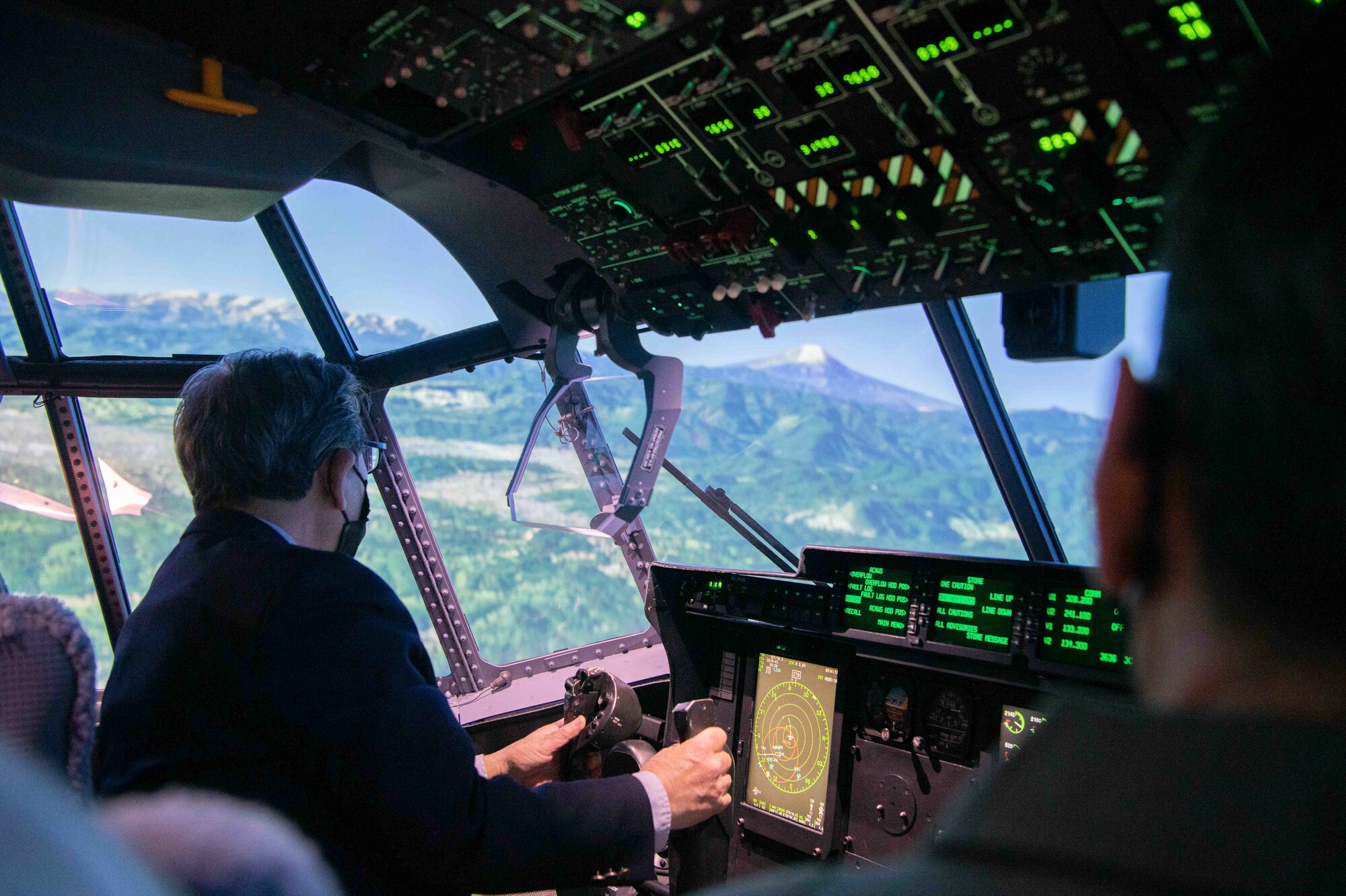 Hirotaka Hashimoto, Mayor of Hamura City, Japan, pilots a C-130J Super Hercules simulator during a community engagement event at Yokota Air Base, Japan, Feb. 17, 2023.