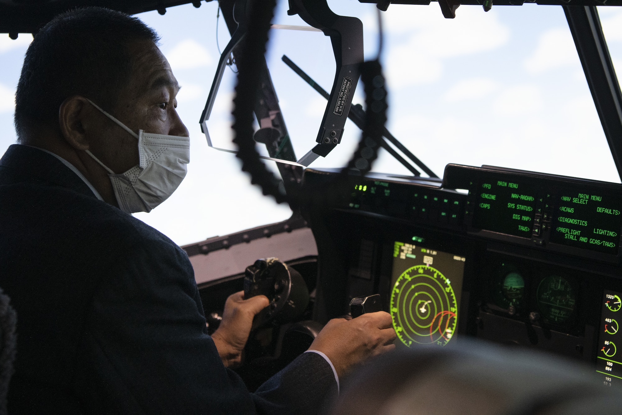 Hiroki Ishikawa, Vice Mayor of Musashimurayama City, Japan, pilots a C-130J Super Hercules simulator during a community engagement event at Yokota Air Base, Japan, Feb. 3, 2023.