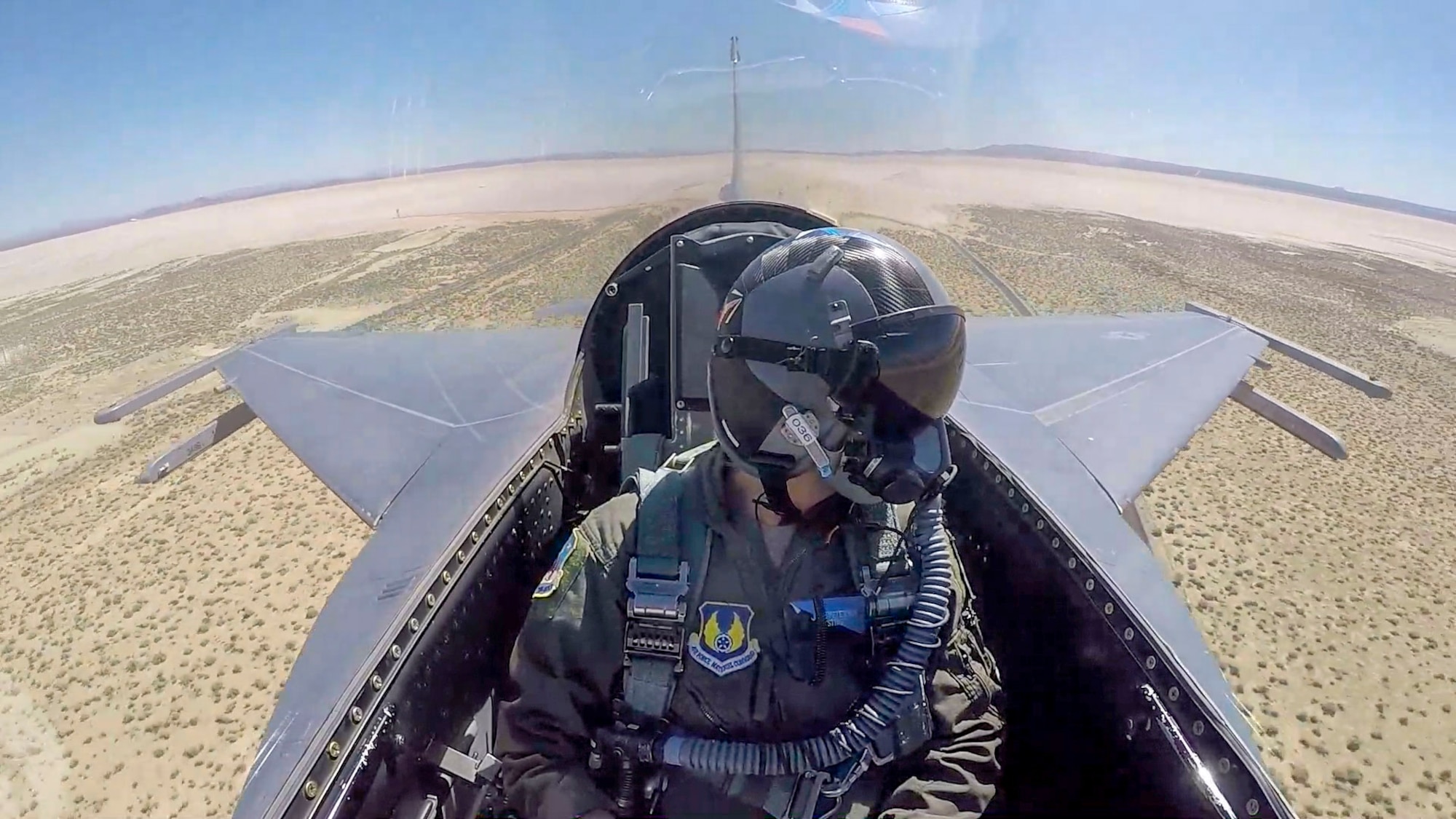 An F-16 Fighting Falcon conducts a Tower Fly-By for the USAF Test Pilot School's Flight Test Engineering students. The Tower-Fly by curriculum event is used at USAF TPS to expose students to multiple learning objectives such as safety planning, monitoring of safety critical parameters, use of radio communication, collection of flight and ground data, and the analysis and reporting of flight test results.