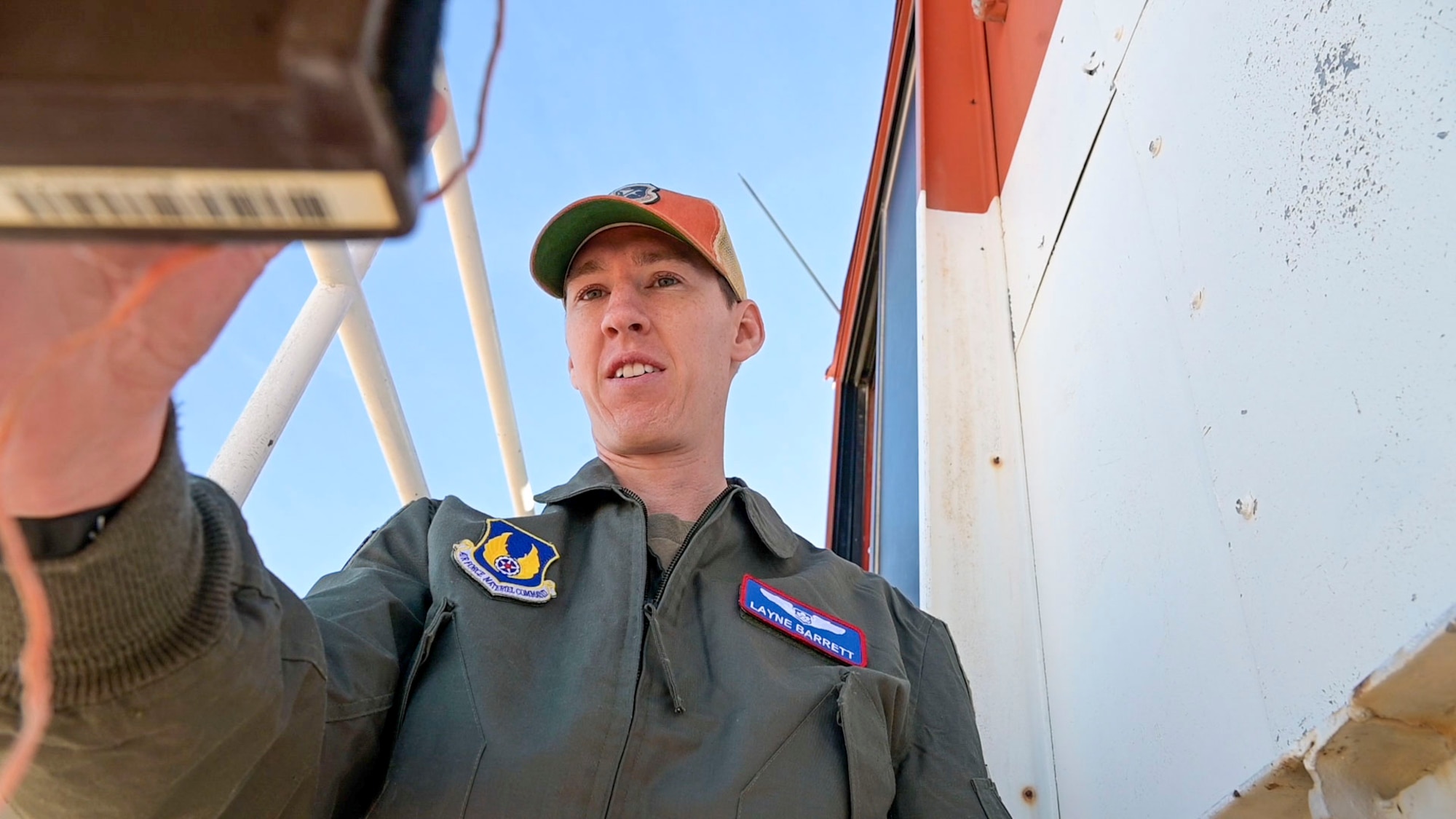 Capt. Layne Barrett, Student, USAF Test Pilot School records temperature data during the Tower Fly-By event. The Tower Fly-By curriculum event is used at USAF TPS to expose students to multiple learning objectives such as safety planning, monitoring of safety critical parameters, use of radio communication, collection of flight and ground data, and the analysis and reporting of flight test results.