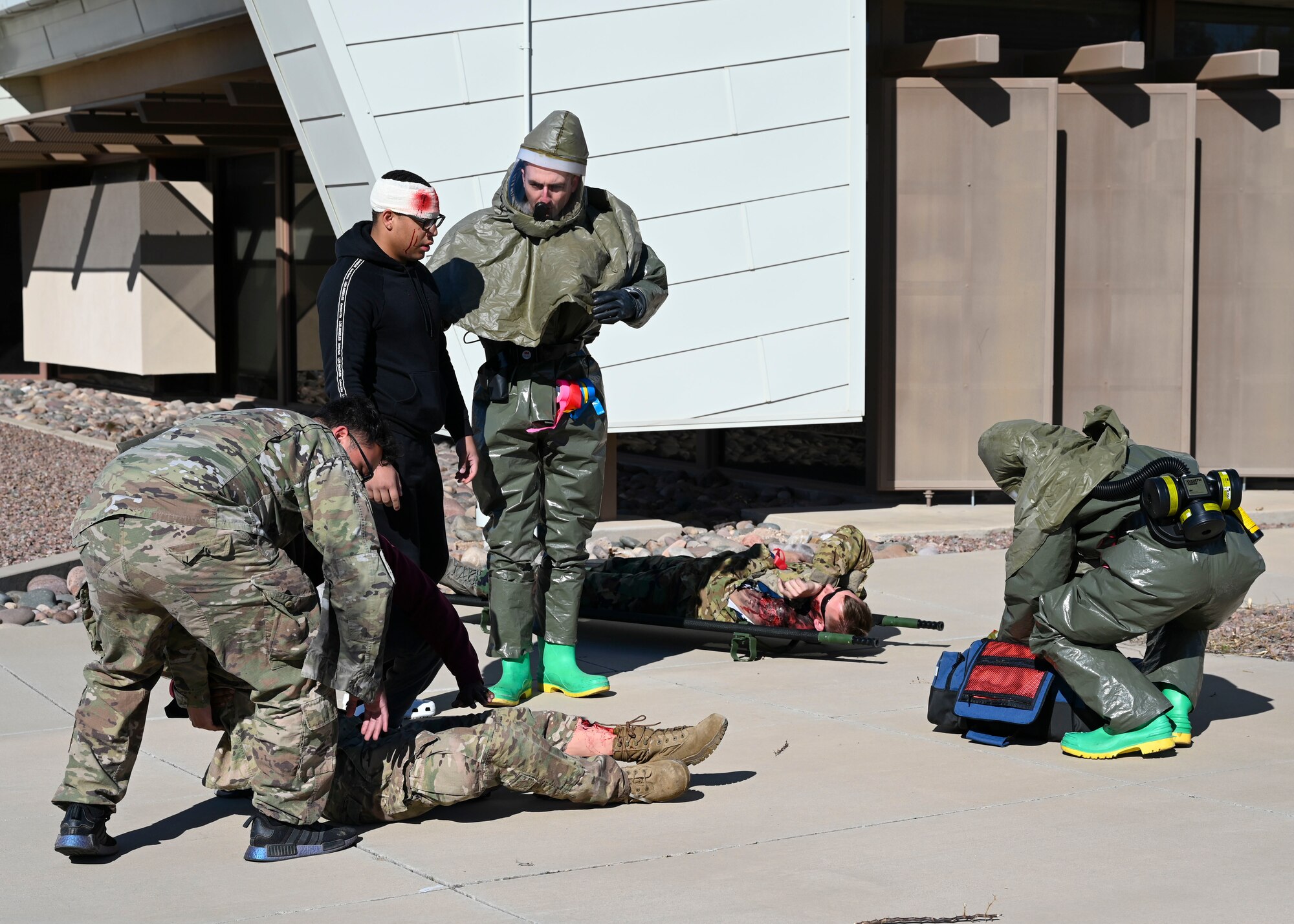 Airmen provide treatment to simulated casualties during a mass casualty training exercise at Davis-Monthan Air Force Base