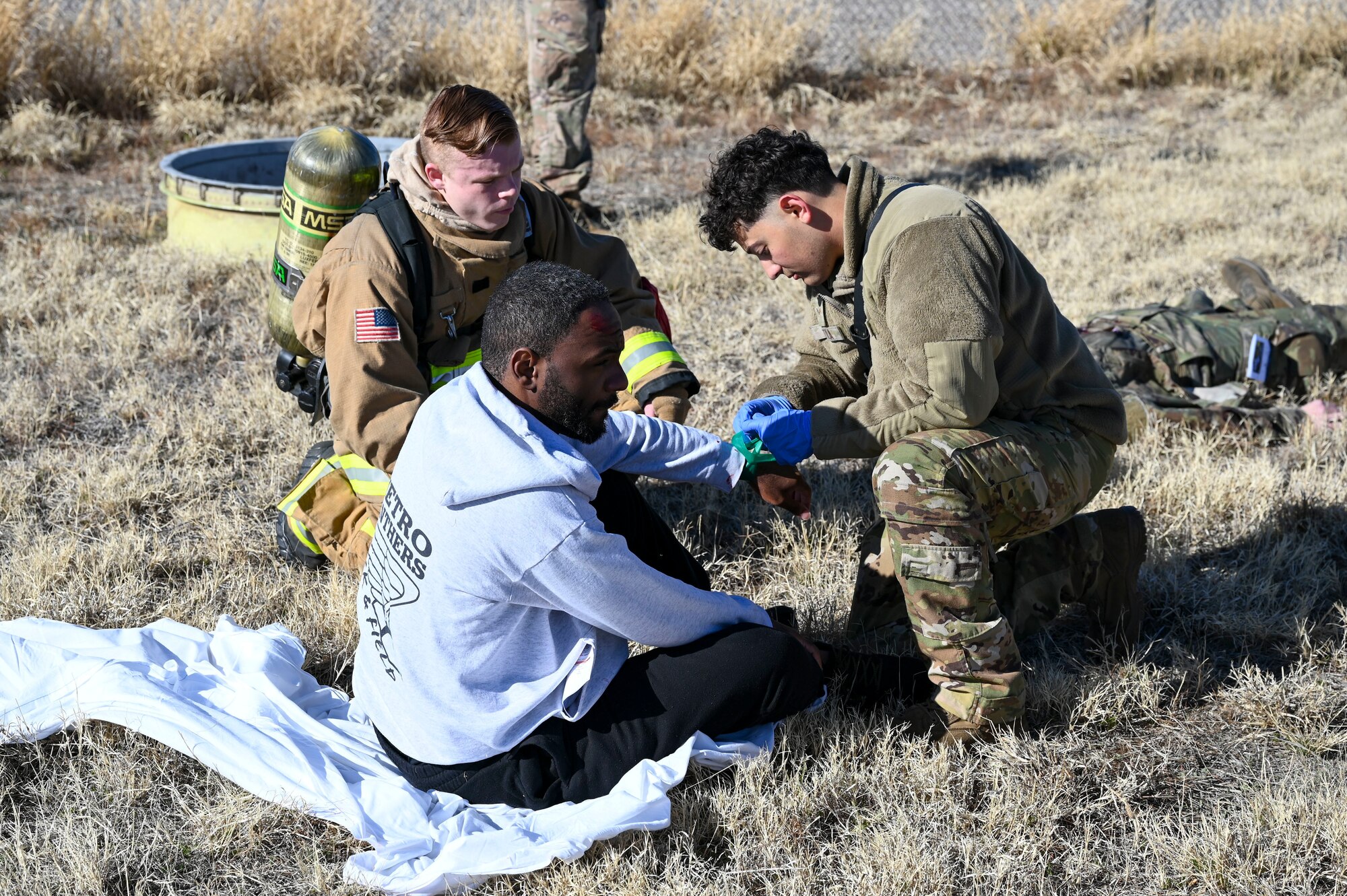 Airmen provide treatment to simulated casualties during a mass casualty training exercise at Davis-Monthan Air Force Base