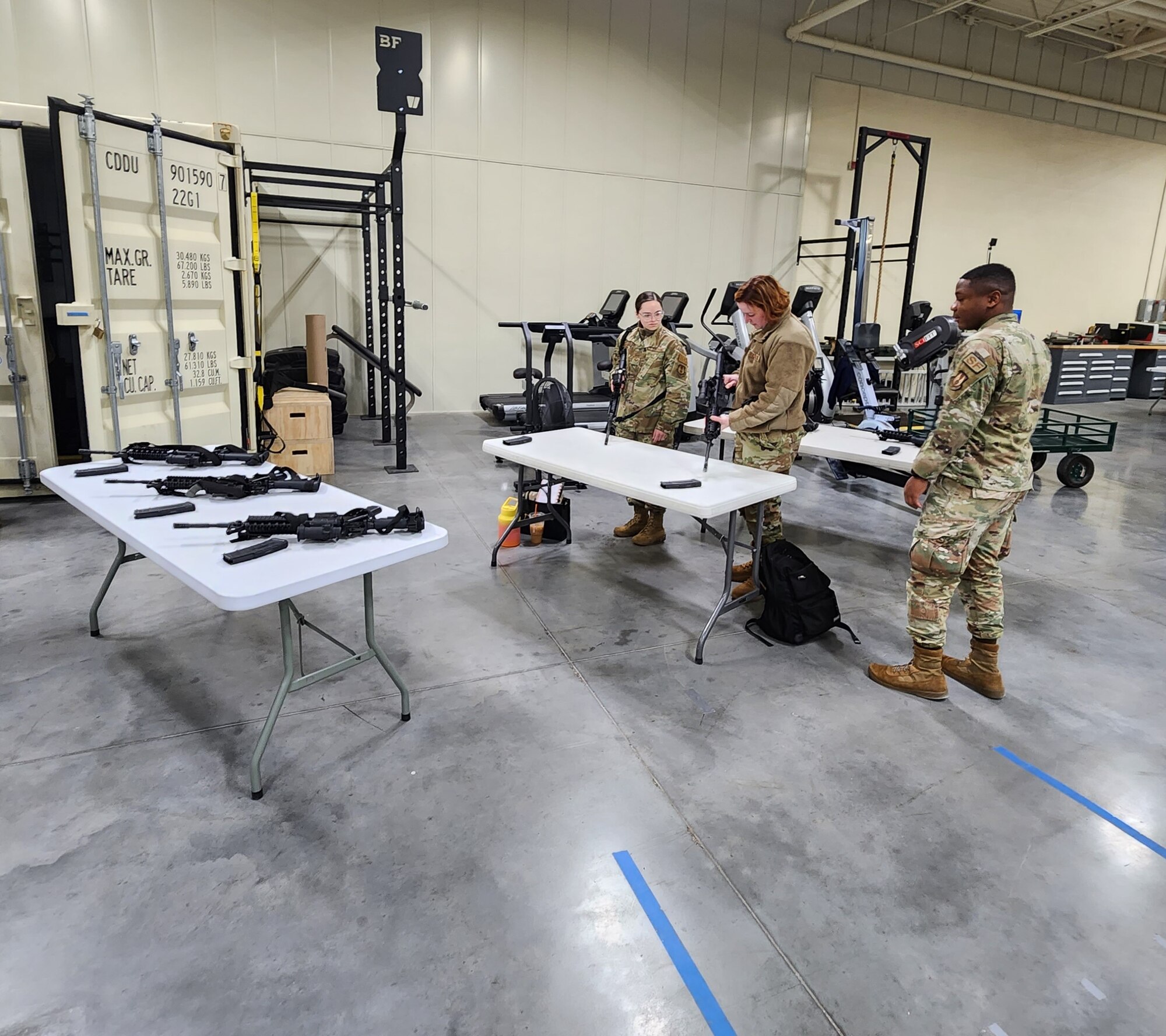 U.S. Airmen with the 75th Wing Staff Agencies practice properly assembling and disassembling M4 Carbines during a weapons familiarization training event Feb. 8, 2023, at Hill Air Force Base, Utah. The training event was held as part of the Ready Airman Training concept which prepares Airmen in areas such as combat arms and Tactical Combat Casualty Care. (Courtesy photo)
