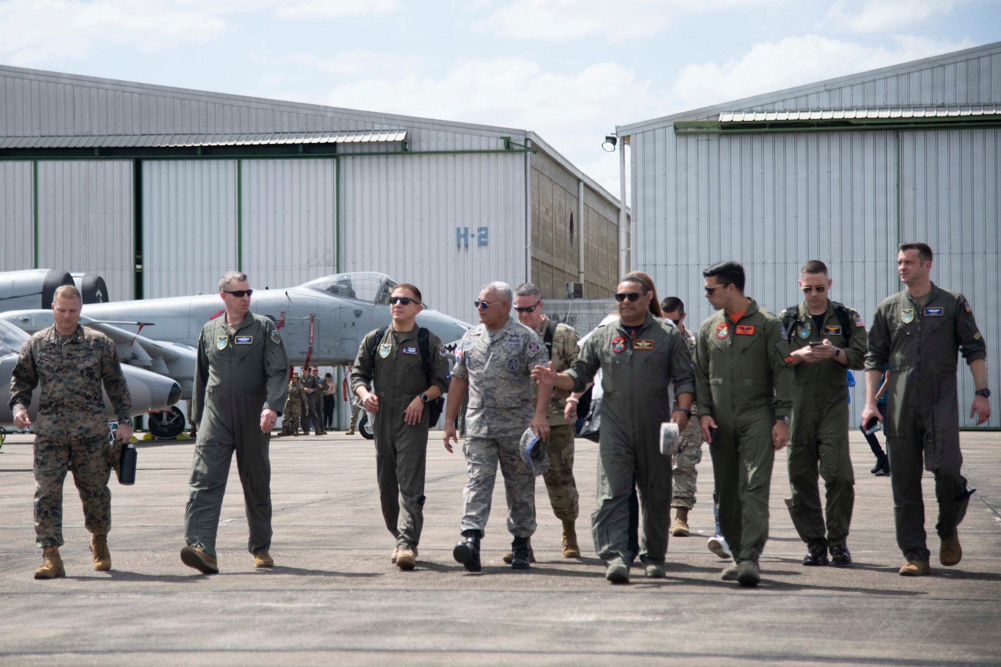 People walking on flight line