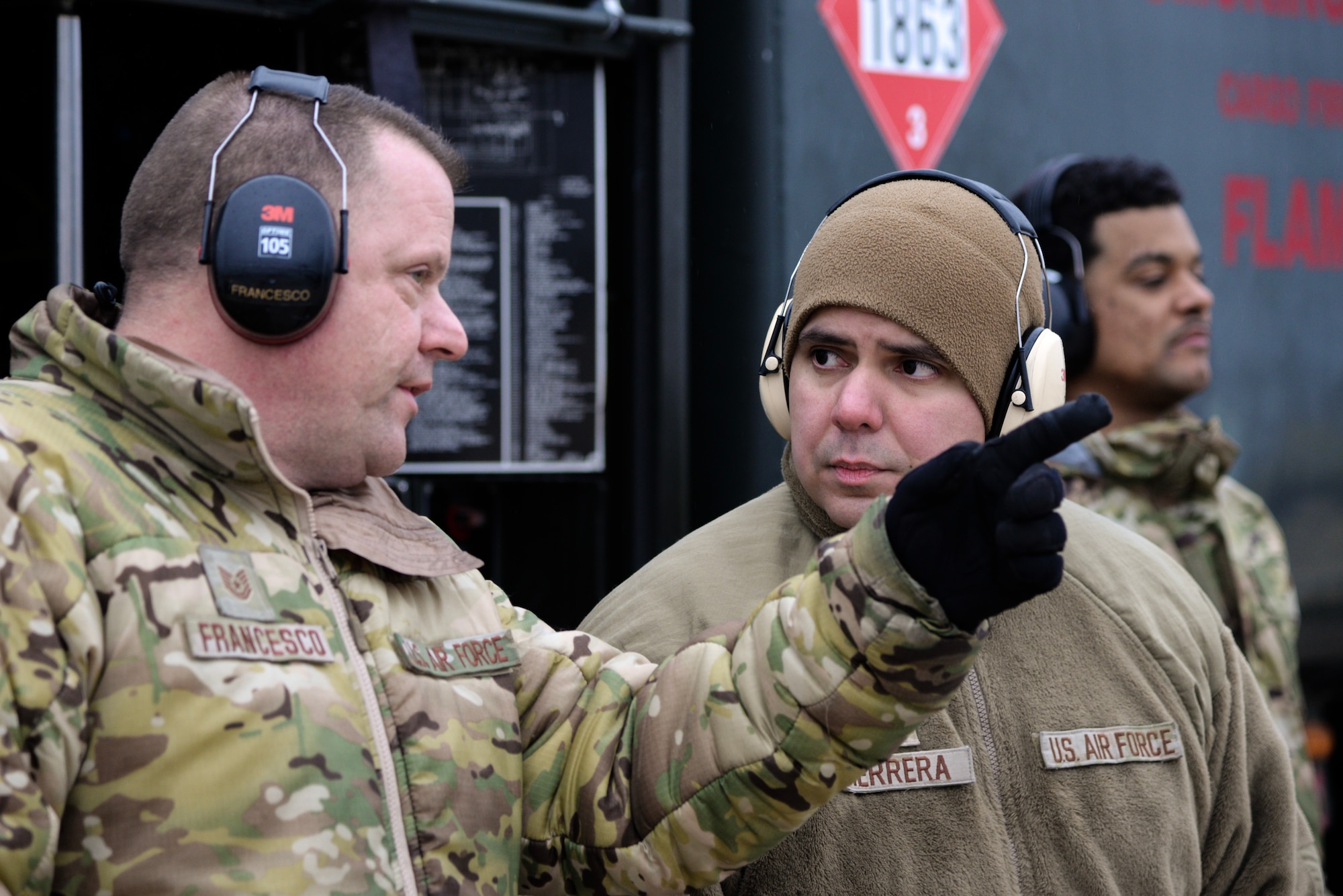 A photo of Tech. Sgt. Dominic Francesco Sr., 177th Logistics Readiness Squadron fuels operations section chief, instructing Staff Sgt. Jonathan Herrera, 157th Logistics Readiness Squadron fuels distribution supervisor, how to perform a hot-pit refuel of an F-16C+ Fighting Falcon during Integrated Combat Turnaround training.