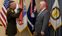 Lt. Gen. Daniel L. Karbler, commanding general, U.S. Army Space and Missile Defense Command, administers the oath of office to Timothy F. Bishop, director, Space and Missile Defense Center of Excellence, during his promotion and assumption of responsibility ceremony at the command’s Redstone Arsenal, Alabama, headquarters, Feb. 24. (U.S. Army photo by Carrie David Campbell)