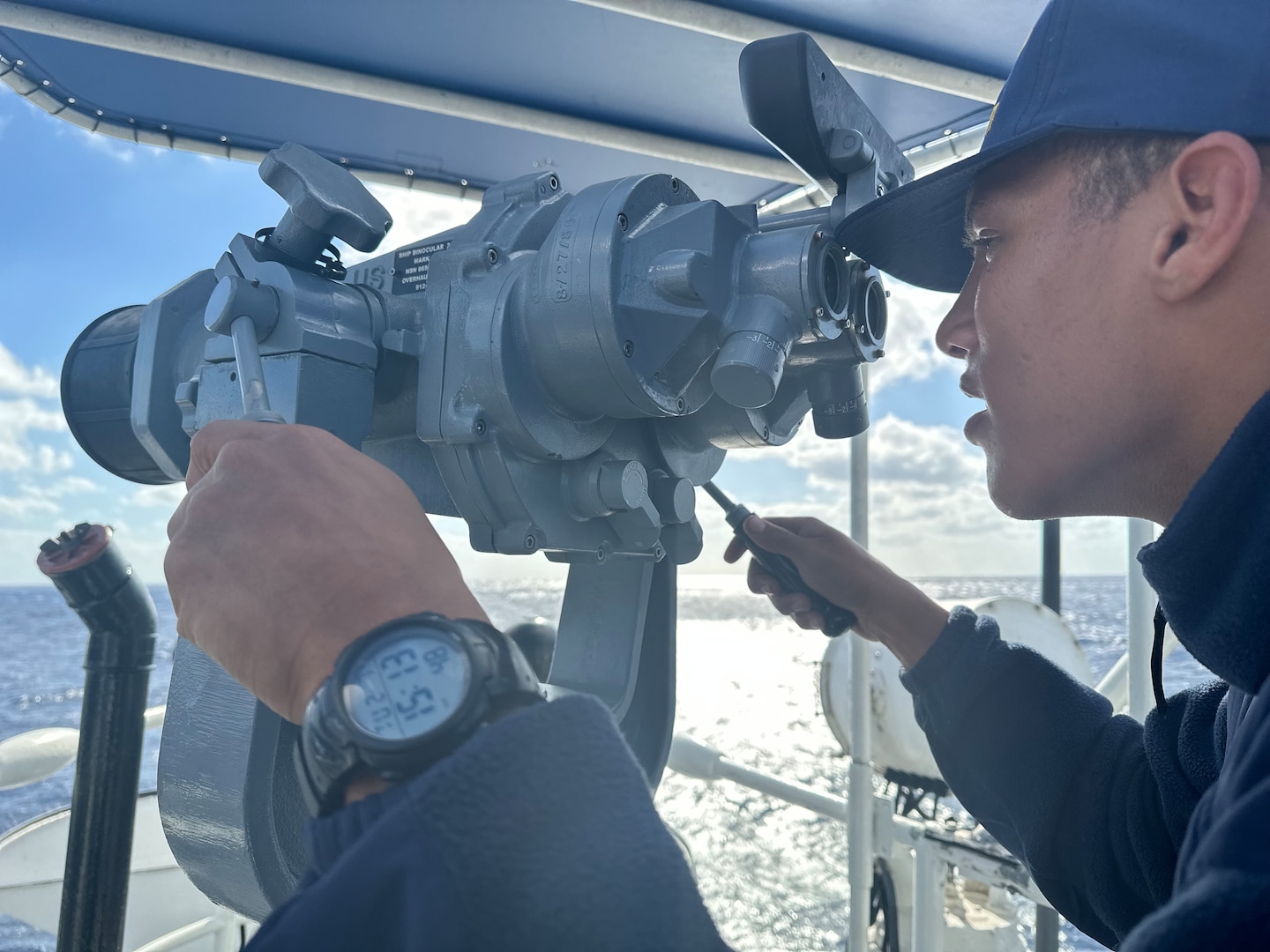 U.S. Coast Guard Seaman Apprentice Greyson Collins, a crew member assigned to USCGC Vigilant (WMEC 617), searches for migrant vessels or vessels in distress throughout the Florida Straits Feb. 7, 2023. Vigilant is on a patrol in support of Operation Vigilant Sentry in the Caribbean Sea. (U.S. Coast Guard photo by Ensign Serheni’te Johnson)