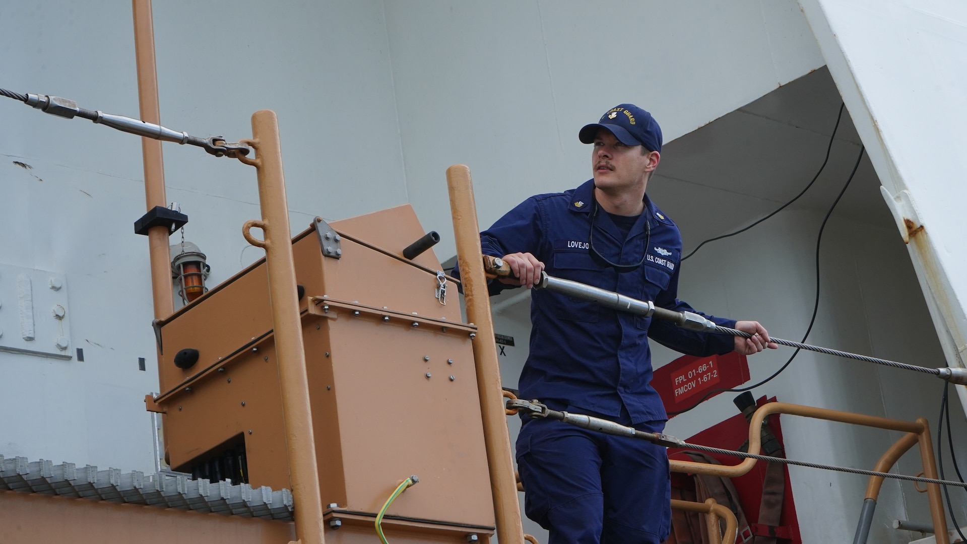U.S. Coast Guard Petty Officer 1st Class Edward Lovejoy, a crew member assigned to USCGC Dependable (WMEC 626), assists with safety maneuvers during the cutter's return to home port in Virginia Beach, Virginia, Feb. 23, 2023, following a 50-day maritime safety and security patrol. Dependable's crew patrolled the Florida Straits and Windward Pass in support of Homeland Security Task Force - Southeast and Operation Vigilant Sentry in the Coast Guard Seventh District's area of responsibility. (U.S. Coast Guard photo by Petty Officer 3rd Class Kate Kilroy)