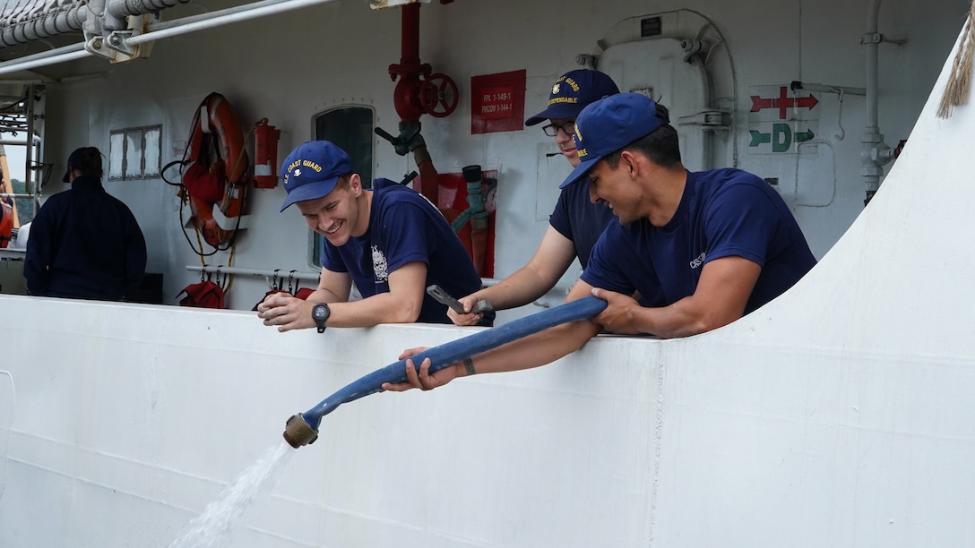 Crew members assigned to USCGC Dependable (WMEC 626) assist with the cutter's return to home port in Virginia Beach, Virginia, Feb. 23, 2023, following a 50-day maritime safety and security patrol. Dependable's crew patrolled the Florida Straits and Windward Pass in support of Homeland Security Task Force - Southeast and Operation Vigilant Sentry in the Coast Guard Seventh District's area of responsibility. (U.S. Coast Guard photo by Petty Officer 3rd Class Kate Kilroy)