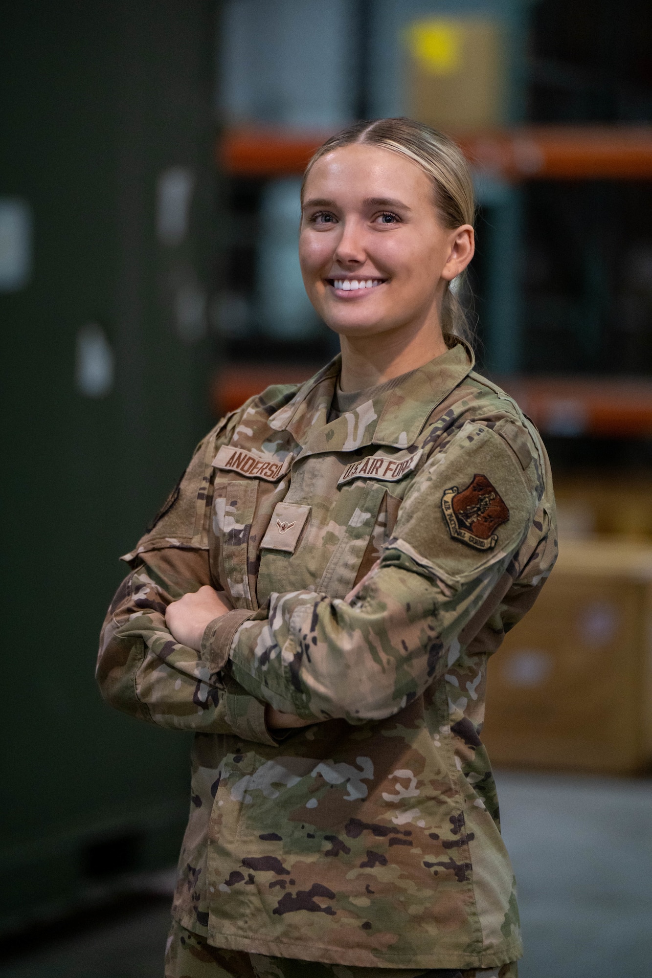 U.S. Air Force Airman 1st Class Ellie Anderson, a customer support apprentice assigned to the 114th Fighter Wing Logistics Readiness Squadron, poses for a portrait as part of a LOBO Highlight project at Joe Foss Field, Feb. 25, 2023.