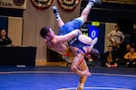 BREMERTON, WA (Feb. 24, 2023) - Army Spc. Spencer Woods of Fort Carson, Colo. throws Senior Airman Angel Romo of Mountain Home AFB, Idaho at 87 kg of the Greco-Roman Championship during the 2023 Armed Forces Wrestling Championship held at Naval Base Kitsap, Bremerton, Washington from February 25-26. This year’s championship features teams from the Army, Navy (including the Marine Corps and Coast Guard Wrestlers), and Air Force (including Space Force Wrestlers). Teams compete in Men’s Greco-Roman, Men’s Freestyle, and Women’s Freestyle wrestling styles. (Photo by Petty Officer 1st Class Ian Carver).