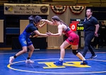 BREMERTON, WA (Feb. 24, 2023) - Senior Airman Haley Franich (U.S. Air Force) squares off with PO3 Joanalicia Ramirez (U.S. Navy) at 55 kg of the 2023 Armed Forces Wrestling Championship held at Naval Base Kitsap, Bremerton, Washington from February 25-26. This year’s championship features teams from the Army, Navy (including the Marine Corps and Coast Guard Wrestlers), and Air Force (including Space Force Wrestlers). Teams compete in Men’s Greco-Roman, Men’s Freestyle, and Women’s Freestyle wrestling styles. (Photo by Petty Officer 1st Class Ian Carver).