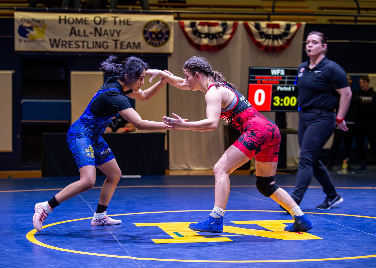 BREMERTON, WA (Feb. 24, 2023) - Senior Airman Haley Franich (U.S. Air Force) squares off with PO3 Joanalicia Ramirez (U.S. Navy) at 55 kg of the 2023 Armed Forces Wrestling Championship held at Naval Base Kitsap, Bremerton, Washington from February 25-26. This year’s championship features teams from the Army, Navy (including the Marine Corps and Coast Guard Wrestlers), and Air Force (including Space Force Wrestlers). Teams compete in Men’s Greco-Roman, Men’s Freestyle, and Women’s Freestyle wrestling styles. (Photo by Petty Officer 1st Class Ian Carver).